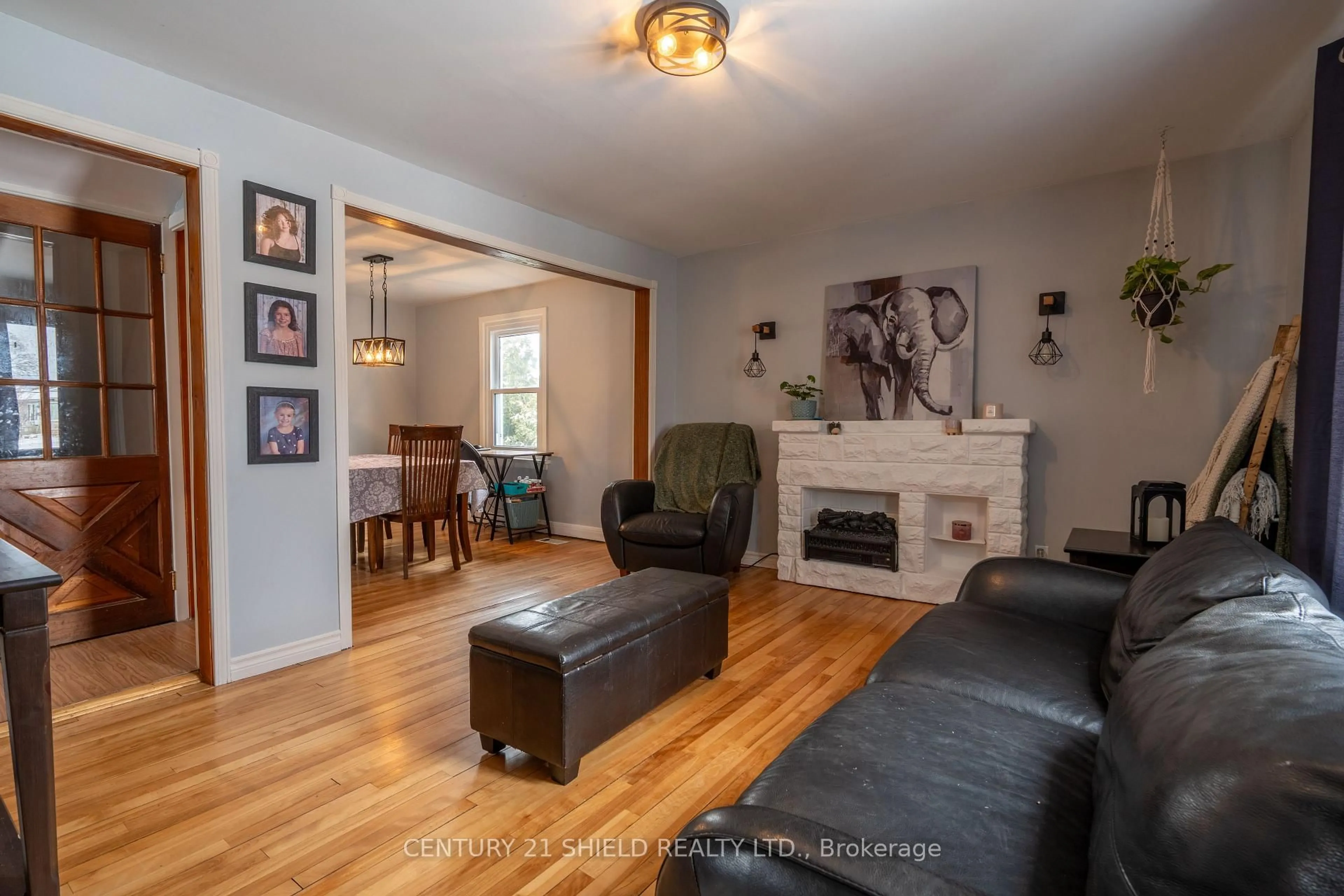 Living room with furniture, wood/laminate floor for 1005 Third St, Cornwall Ontario K6H 2E9