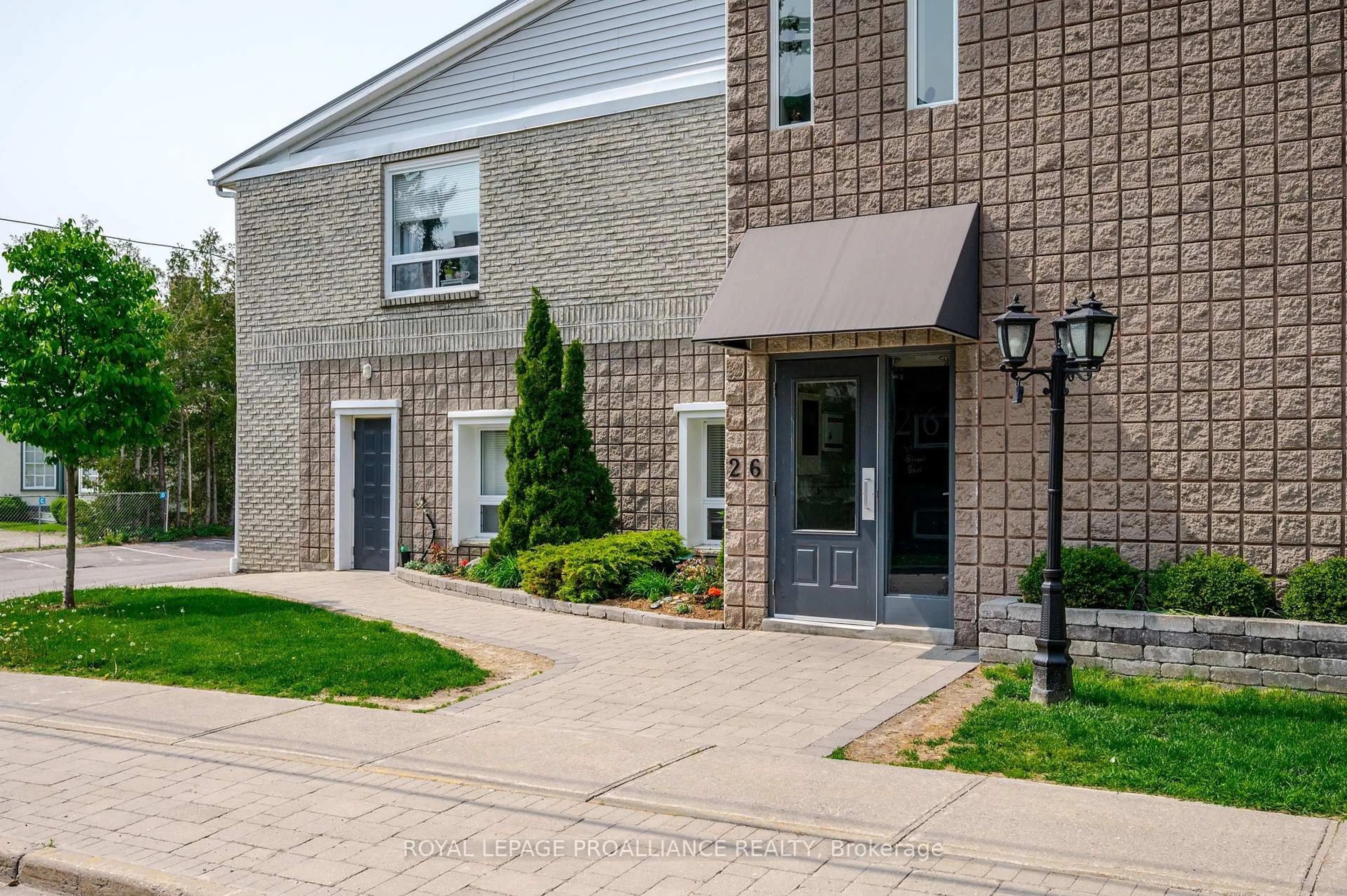 Home with brick exterior material, street for 26 Spencer St #212, Cobourg Ontario K9A 1C2