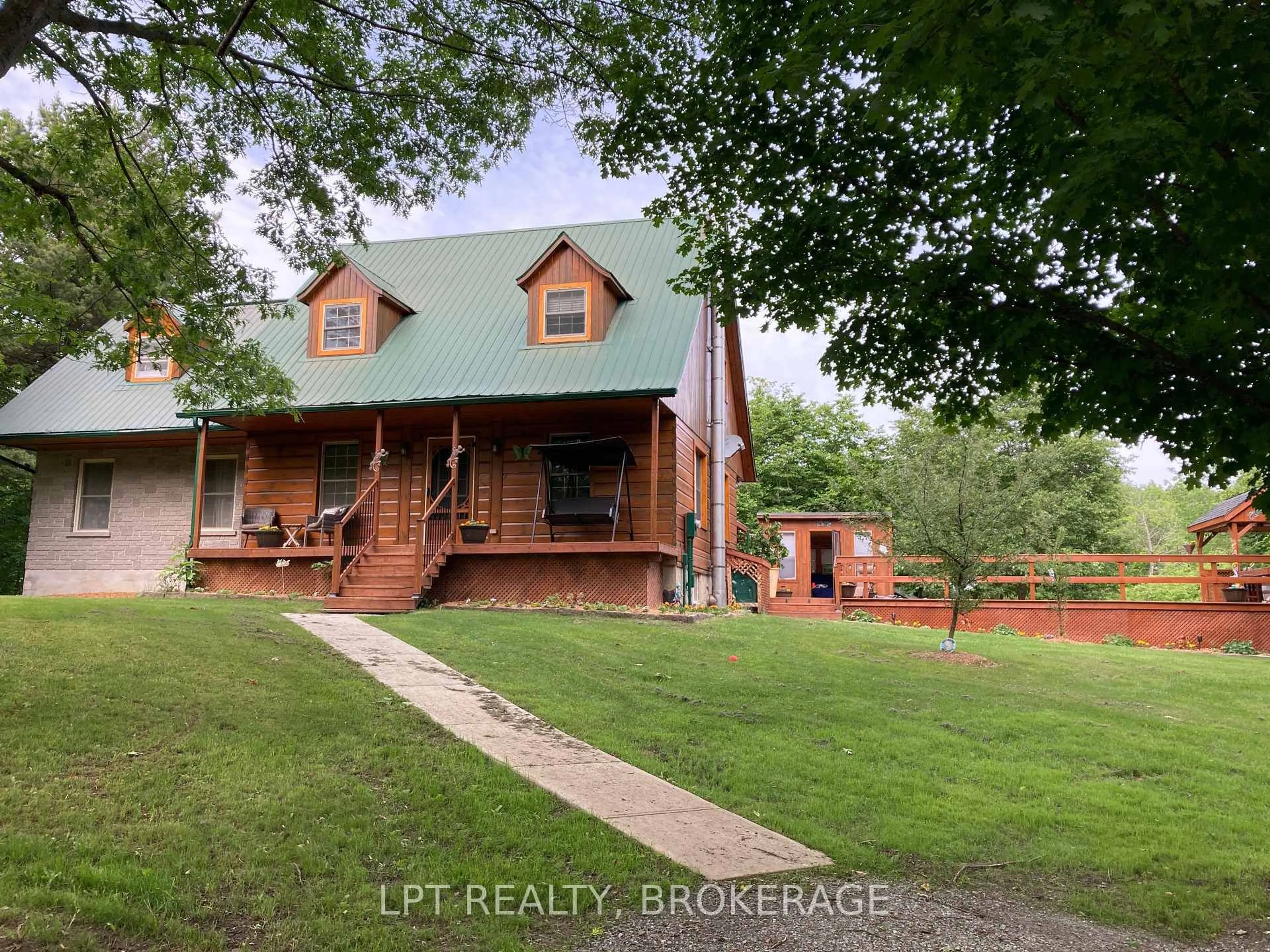 A pic from outside/outdoor area/front of a property/back of a property/a pic from drone, water/lake/river/ocean view for 3691 McConnell Rd, Harrowsmith Ontario K0H 1V0