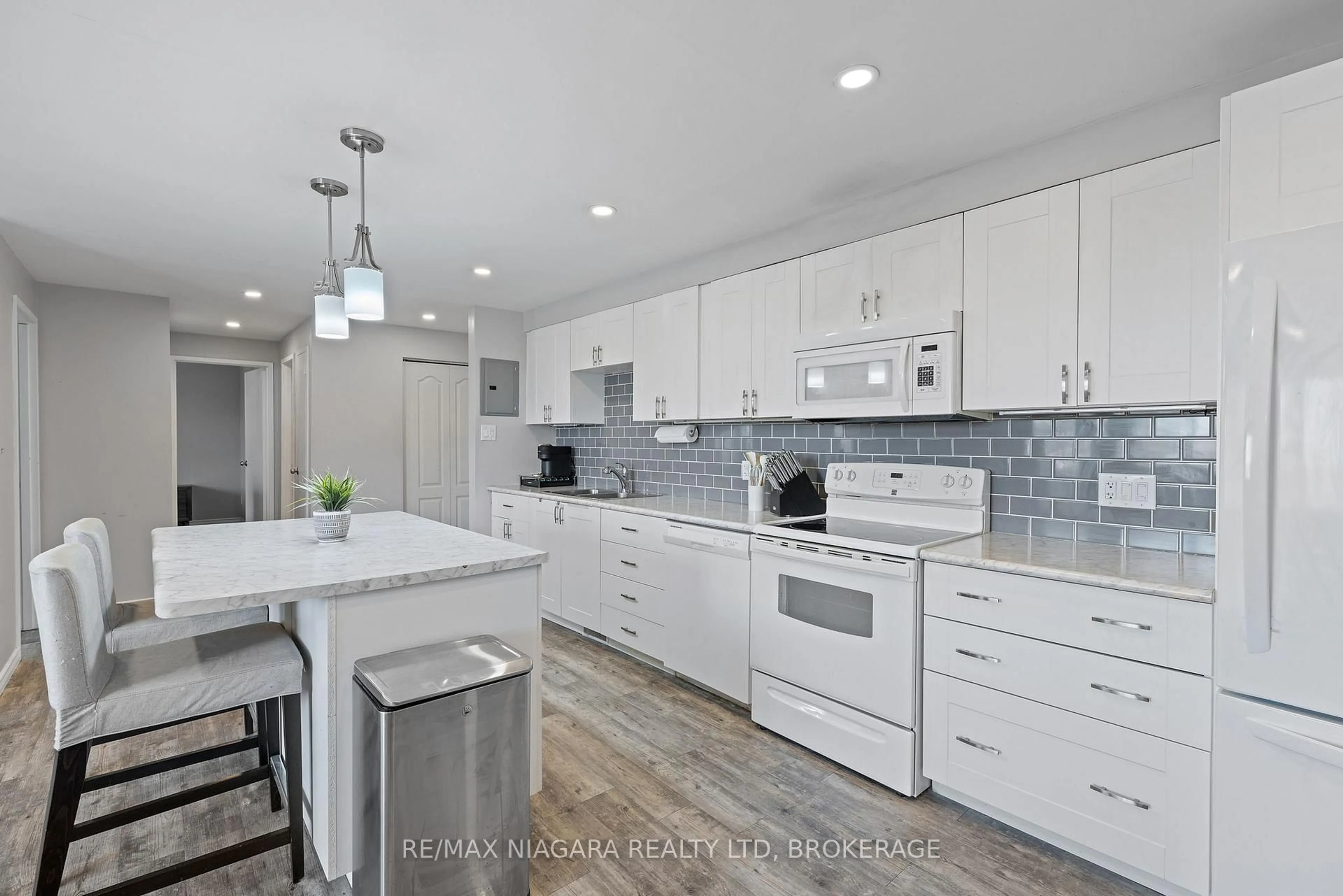 Open concept kitchen, ceramic/tile floor for 198 Scott St #308, St. Catharines Ontario L2N 5T3