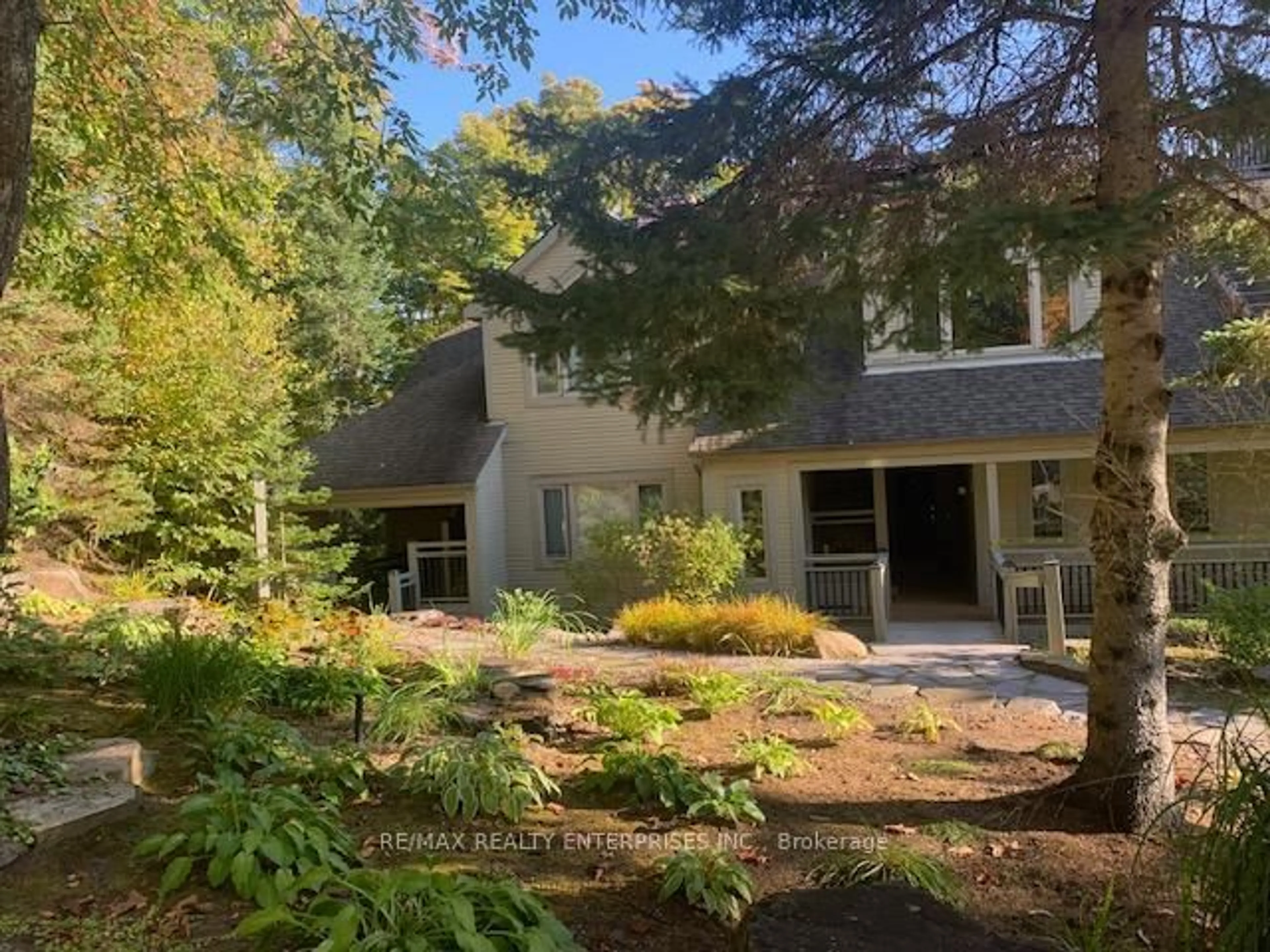 A pic from outside/outdoor area/front of a property/back of a property/a pic from drone, forest/trees view for 4031 Grandview Forest Hill Dr #11, Huntsville Ontario P1H 2J5