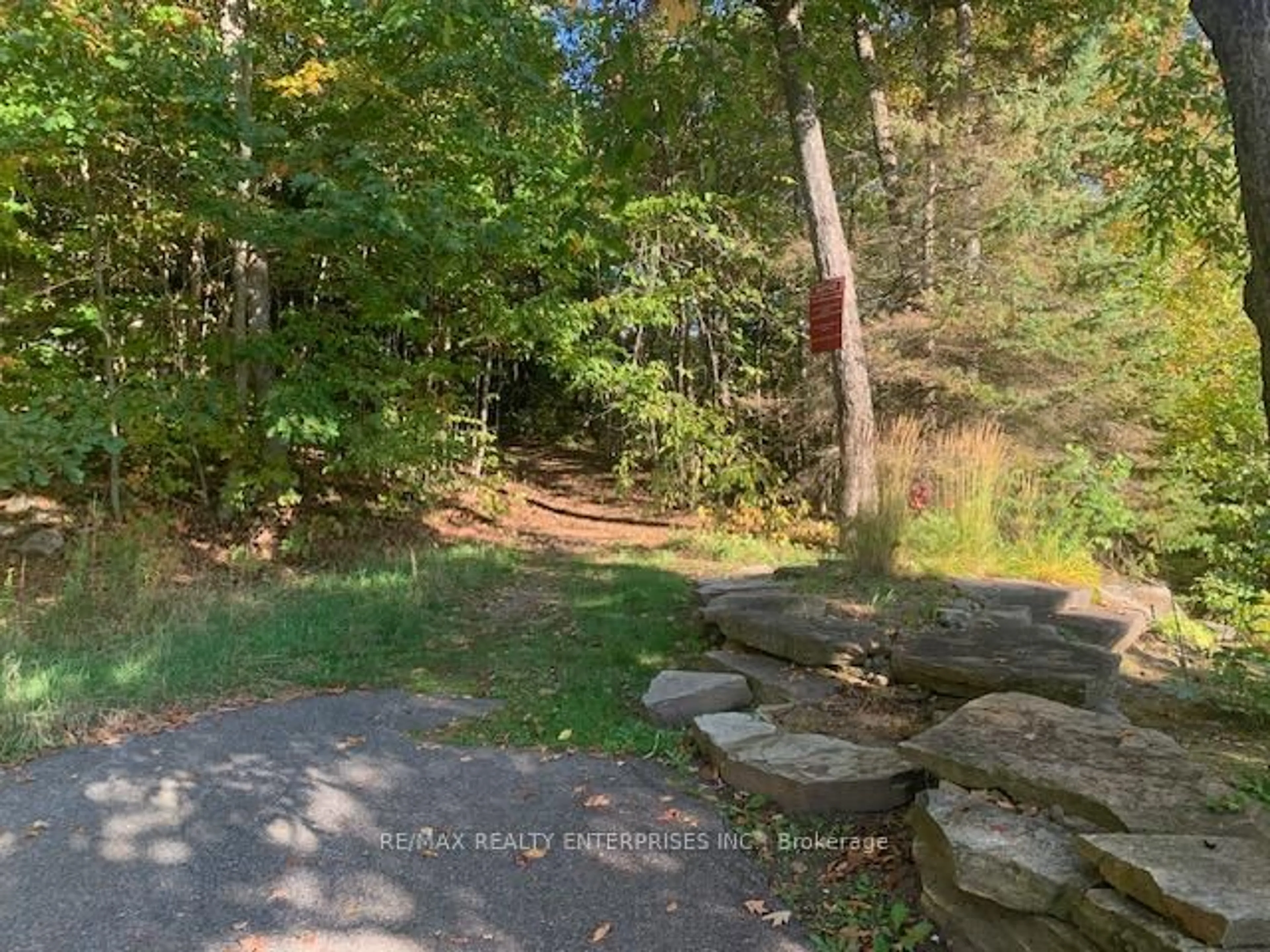 A pic from outside/outdoor area/front of a property/back of a property/a pic from drone, forest/trees view for 4031 Grandview Forest Hill Dr #11, Huntsville Ontario P1H 2J5