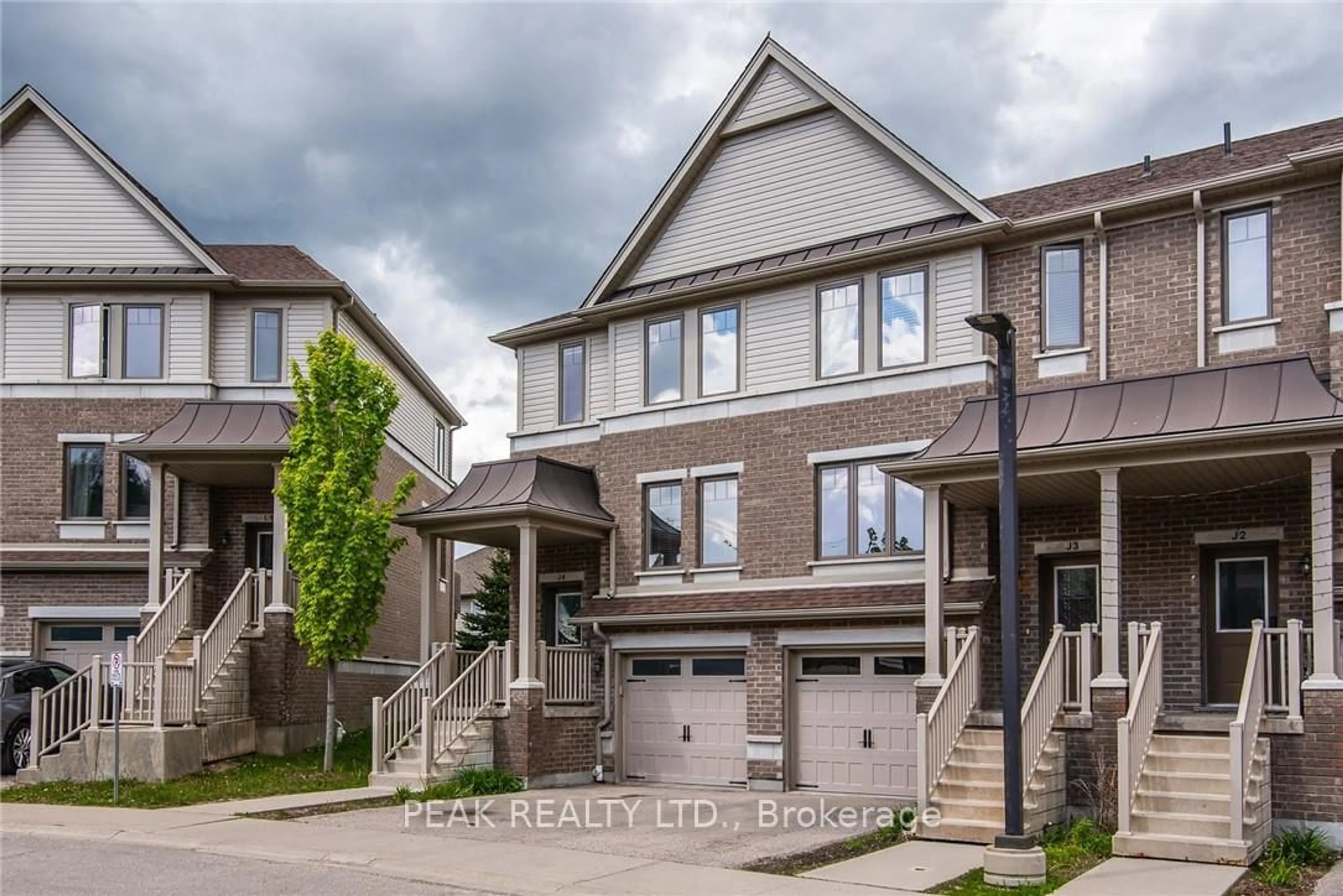 Home with brick exterior material, street for 70 Willowrun Dr #J-3, Kitchener Ontario N2A 0J3