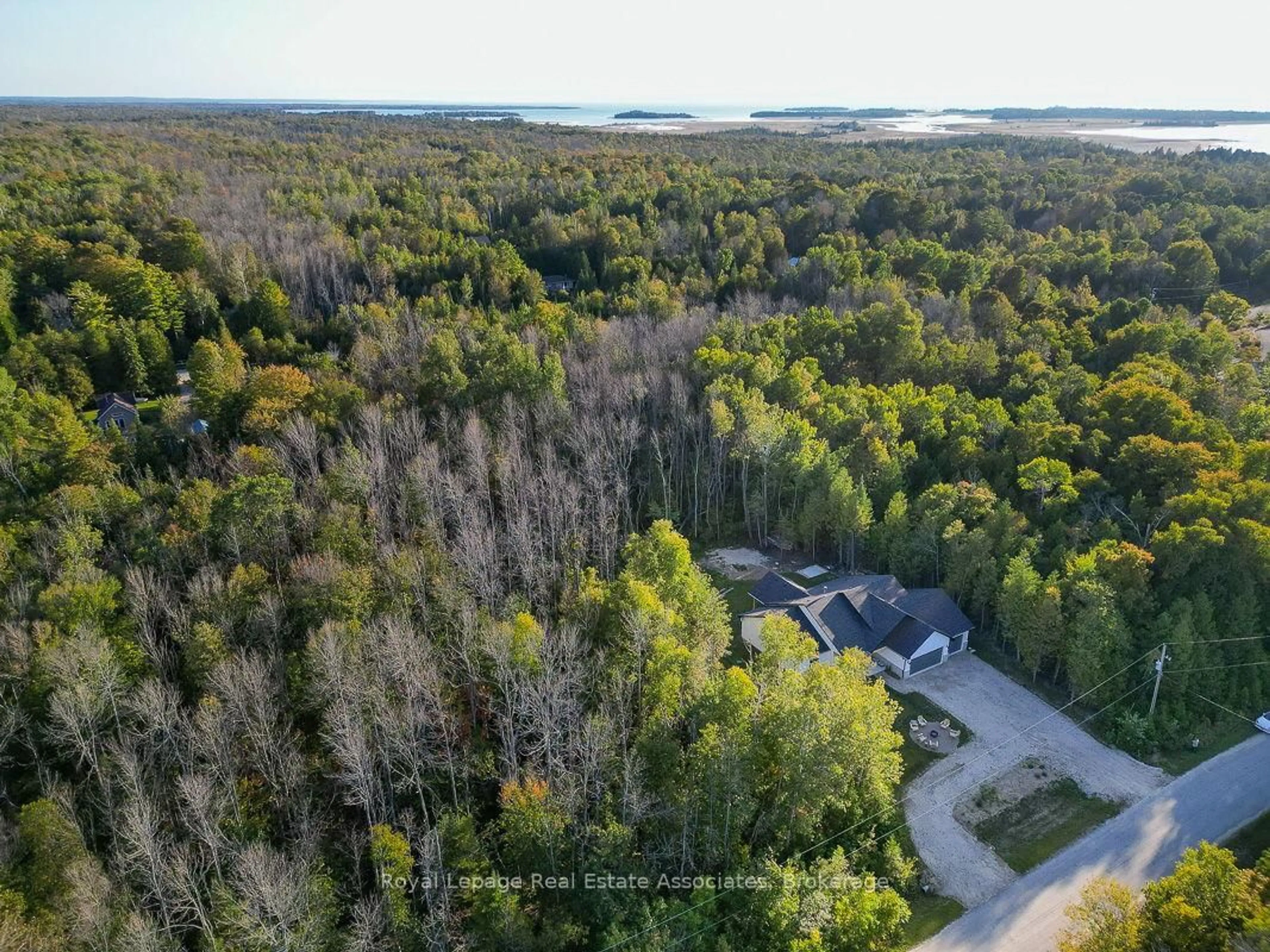 A pic from outside/outdoor area/front of a property/back of a property/a pic from drone, forest/trees view for 18 Tamarac Rd, South Bruce Peninsula Ontario N0H 2T0