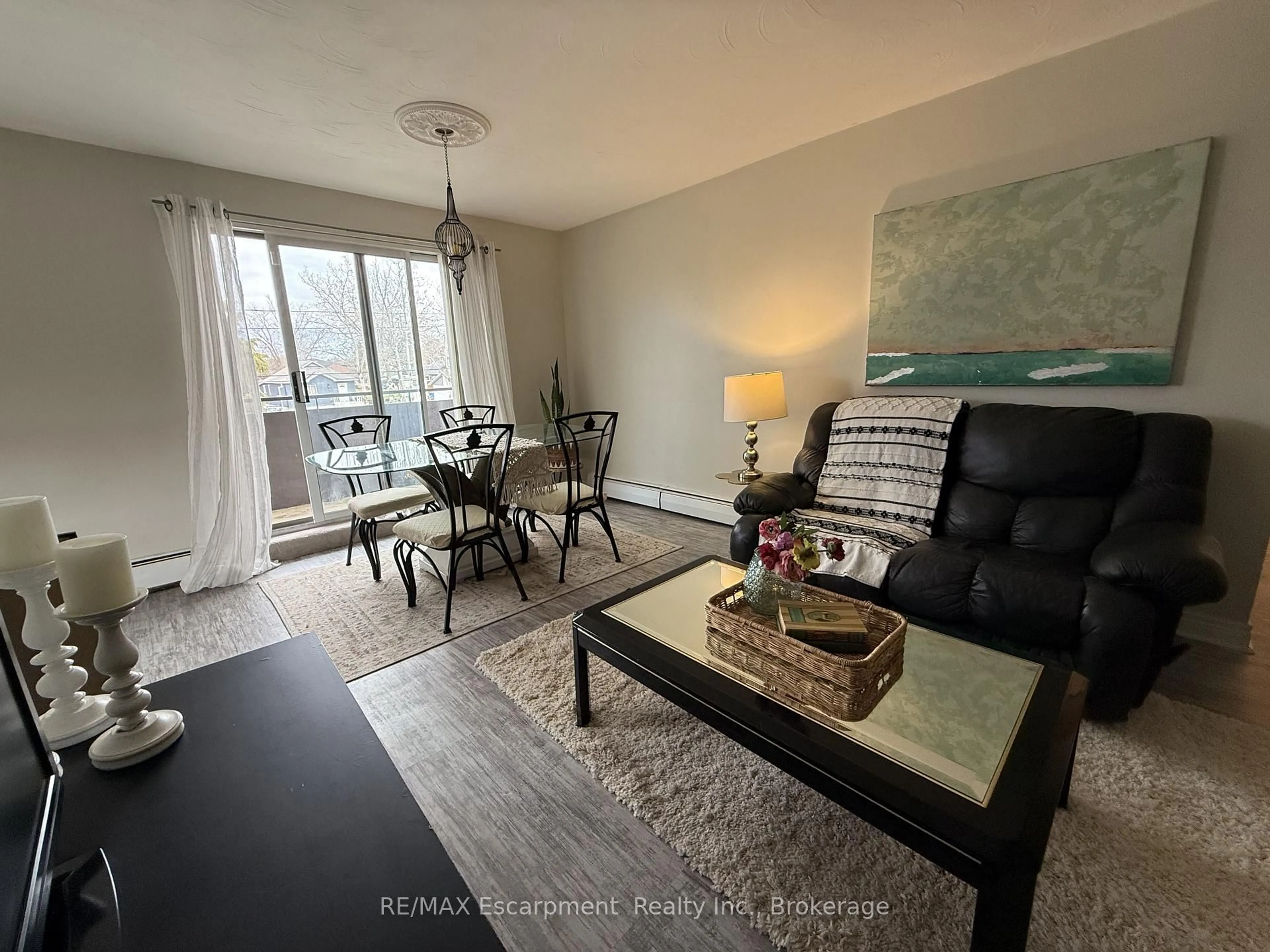 Living room with furniture, unknown for 485 Thorold Rd #203, Welland Ontario L3C 3X1