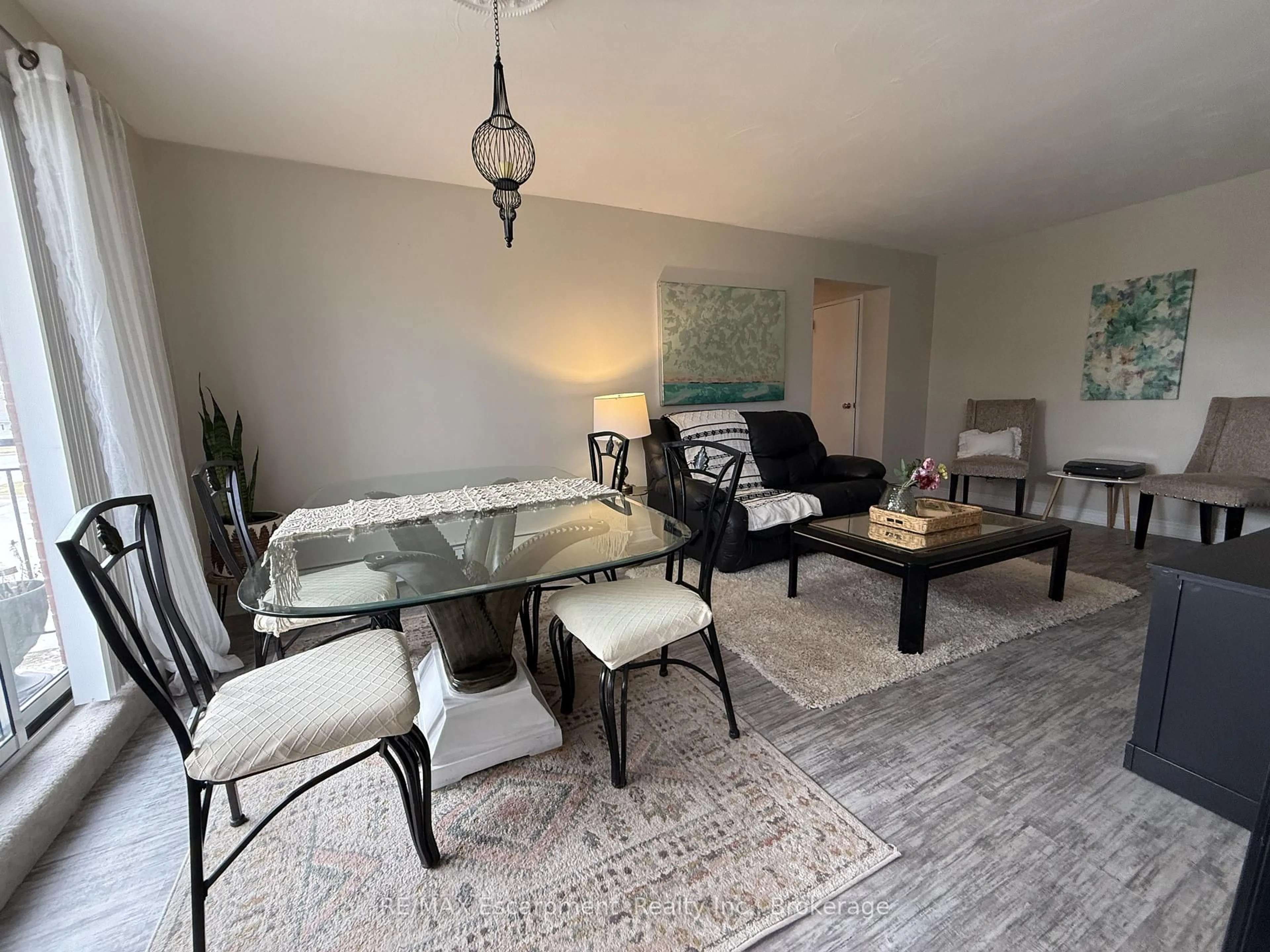 Living room with furniture, unknown for 485 Thorold Rd #203, Welland Ontario L3C 3X1