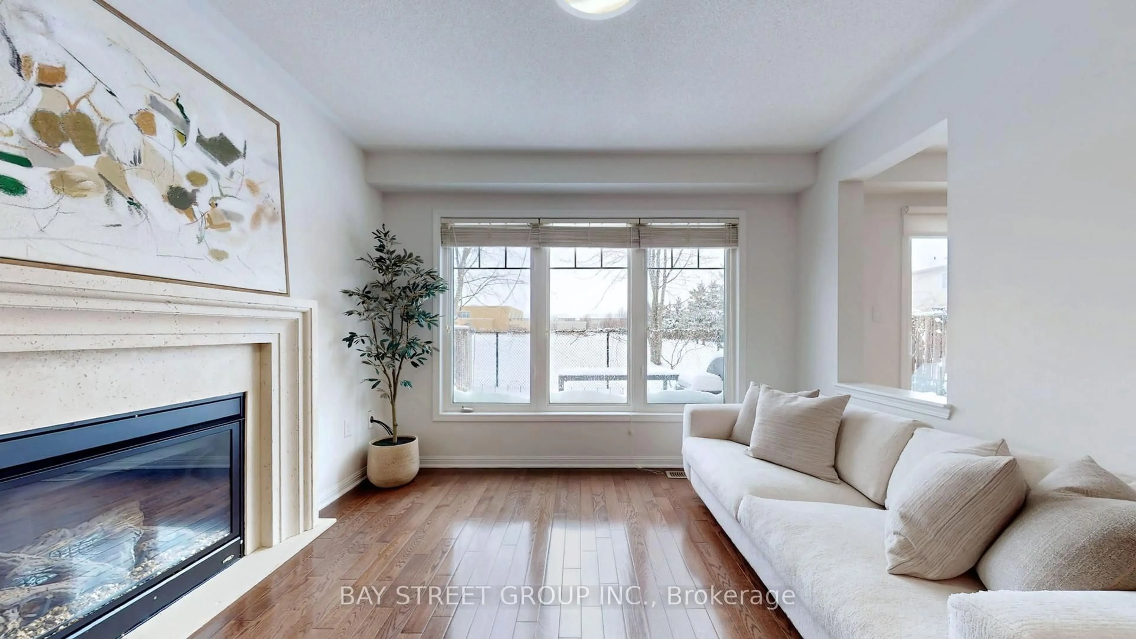 Living room with furniture, wood/laminate floor for 216 Emick Dr, Hamilton Ontario L9K 0E1