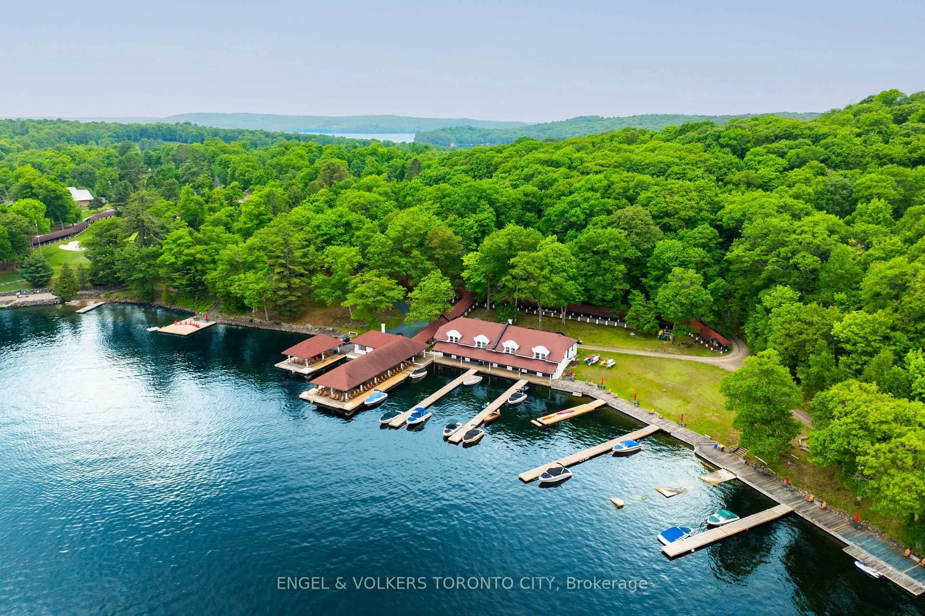 A pic from outside/outdoor area/front of a property/back of a property/a pic from drone, water/lake/river/ocean view for 12 Bigwin Island #221, Lake of Bays Ontario P0B 1A0