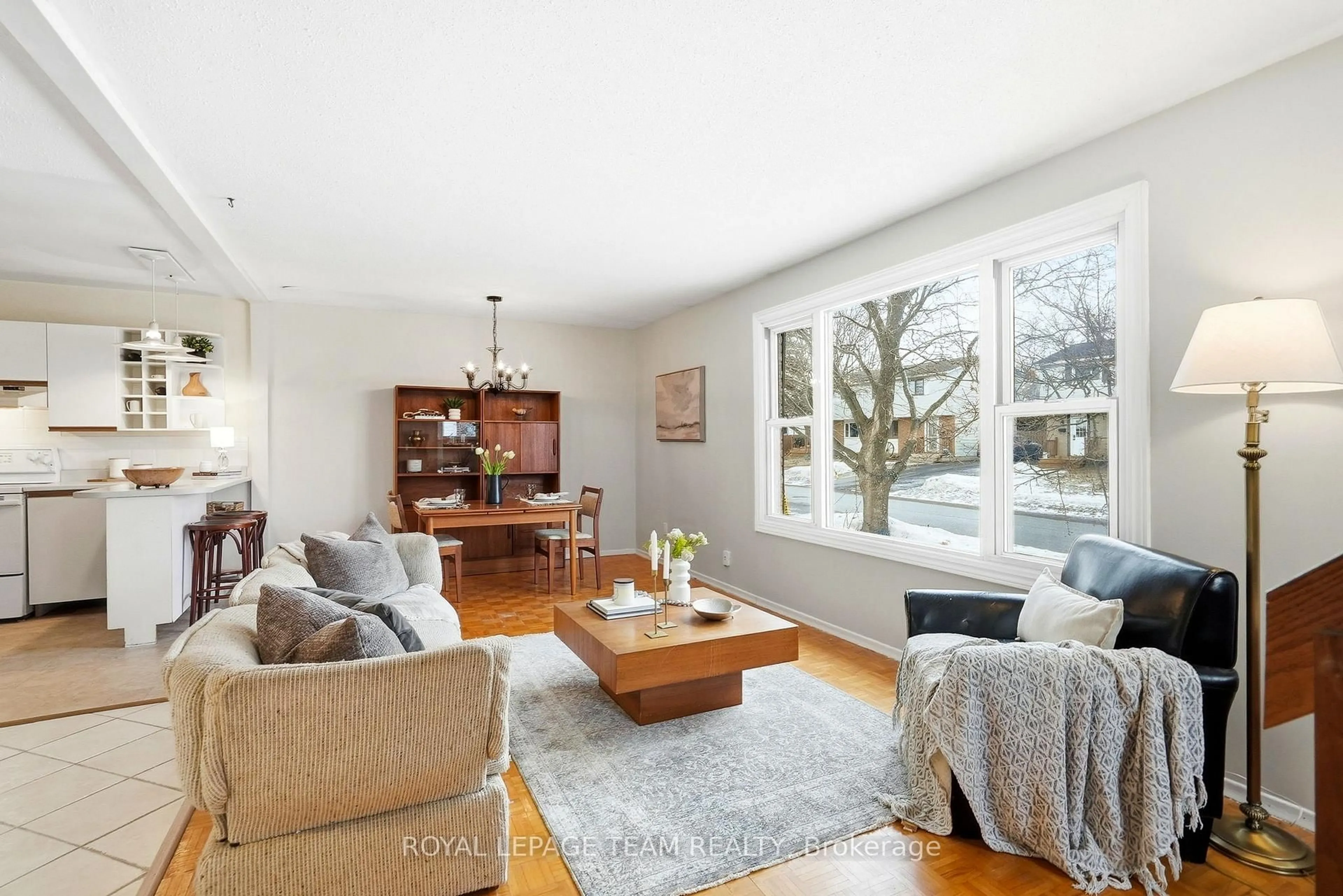 Living room with furniture, wood/laminate floor for 9 Shouldice Cres, Ottawa Ontario K2L 1M8