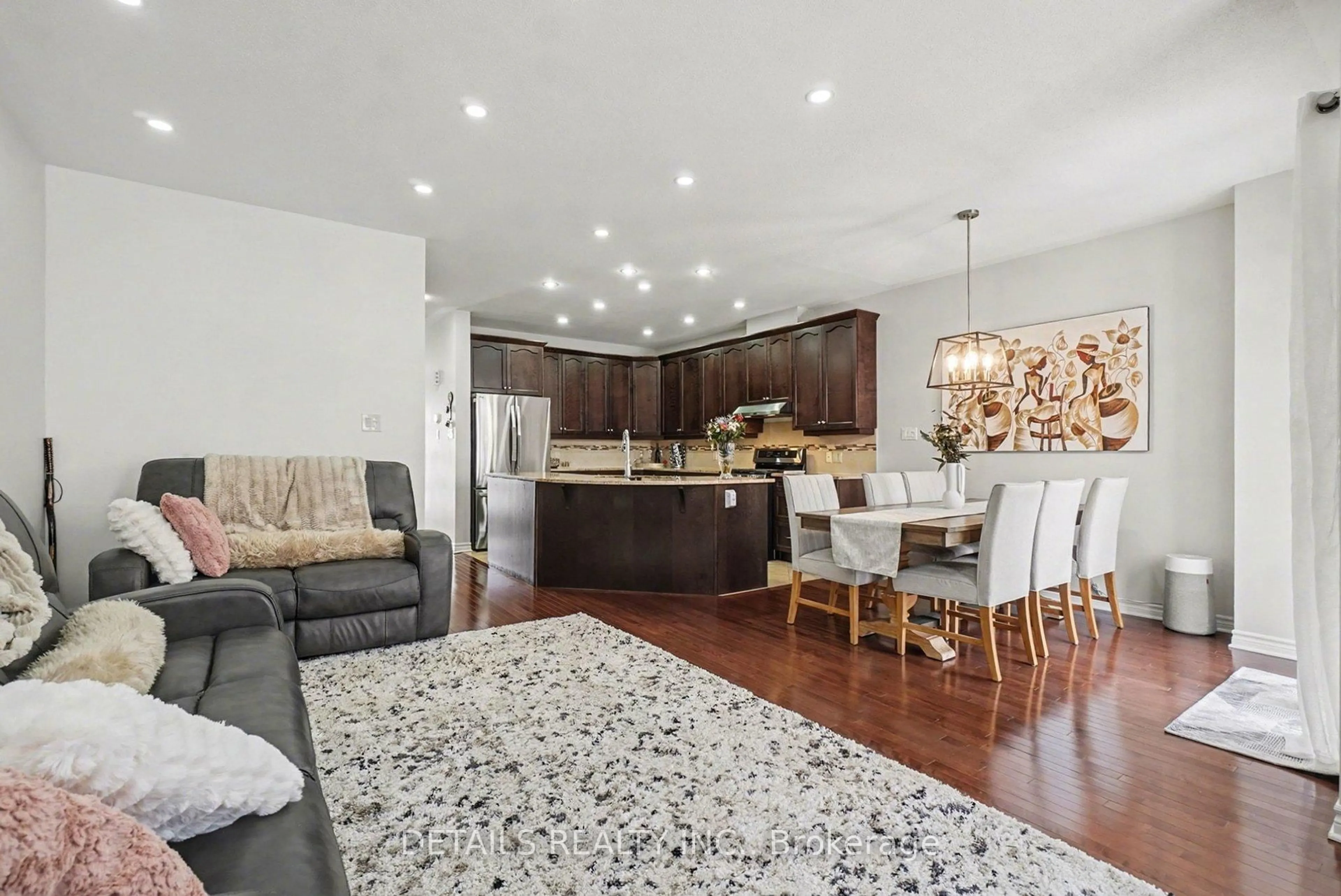 Open concept kitchen, wood/laminate floor for 112 Whispering Winds St, Ottawa Ontario K1W 0B7