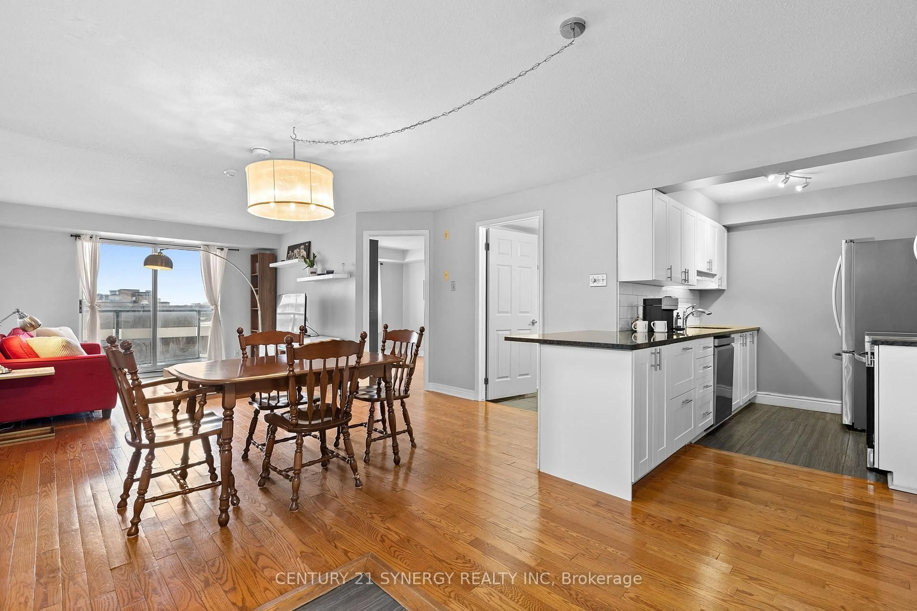 Open concept kitchen, wood/laminate floor for 429 Somerset St #707, Ottawa Ontario K2P 2P5