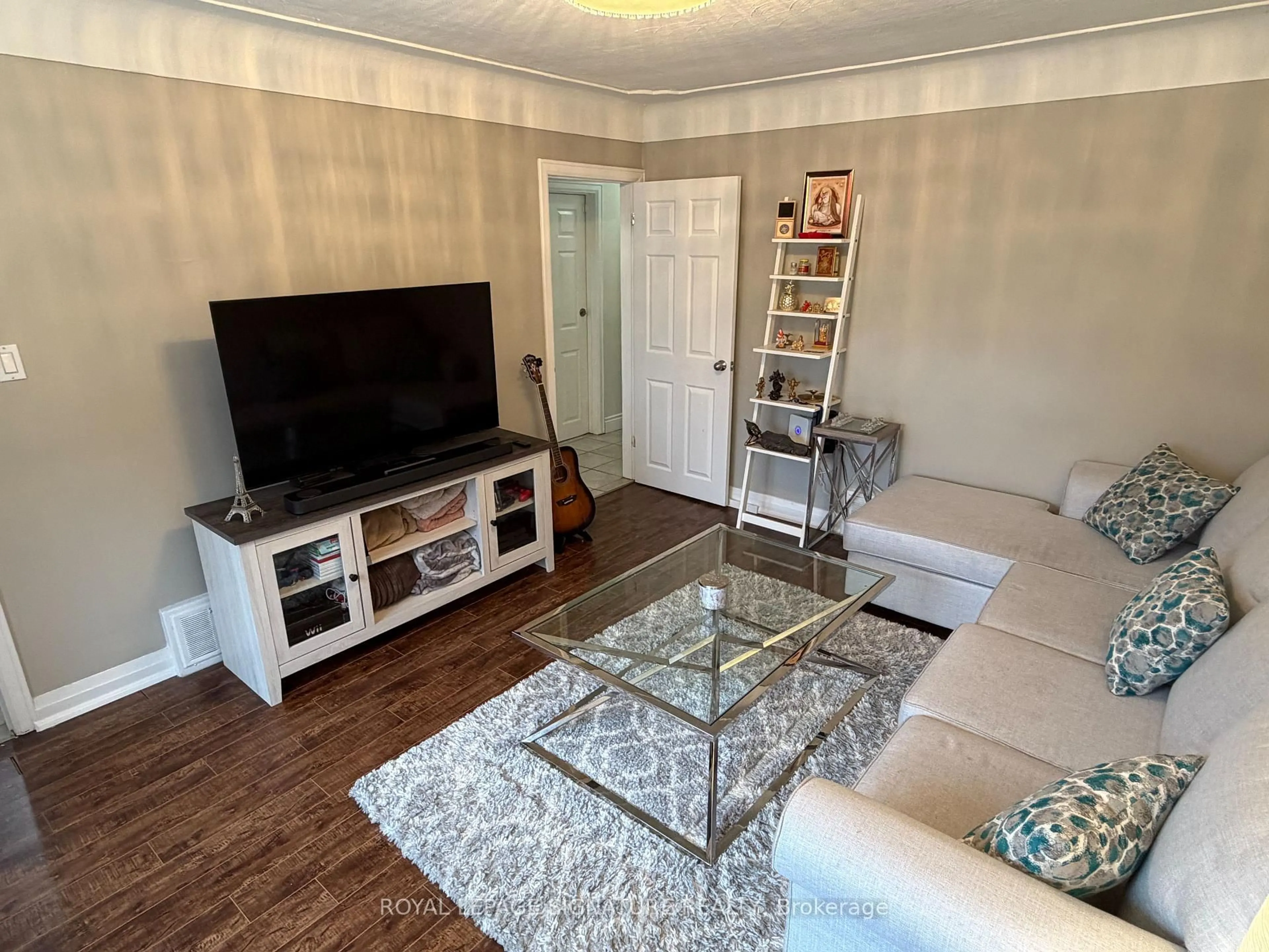 Living room with furniture, wood/laminate floor for 69 Glenmount Ave, Hamilton Ontario L8S 2L3