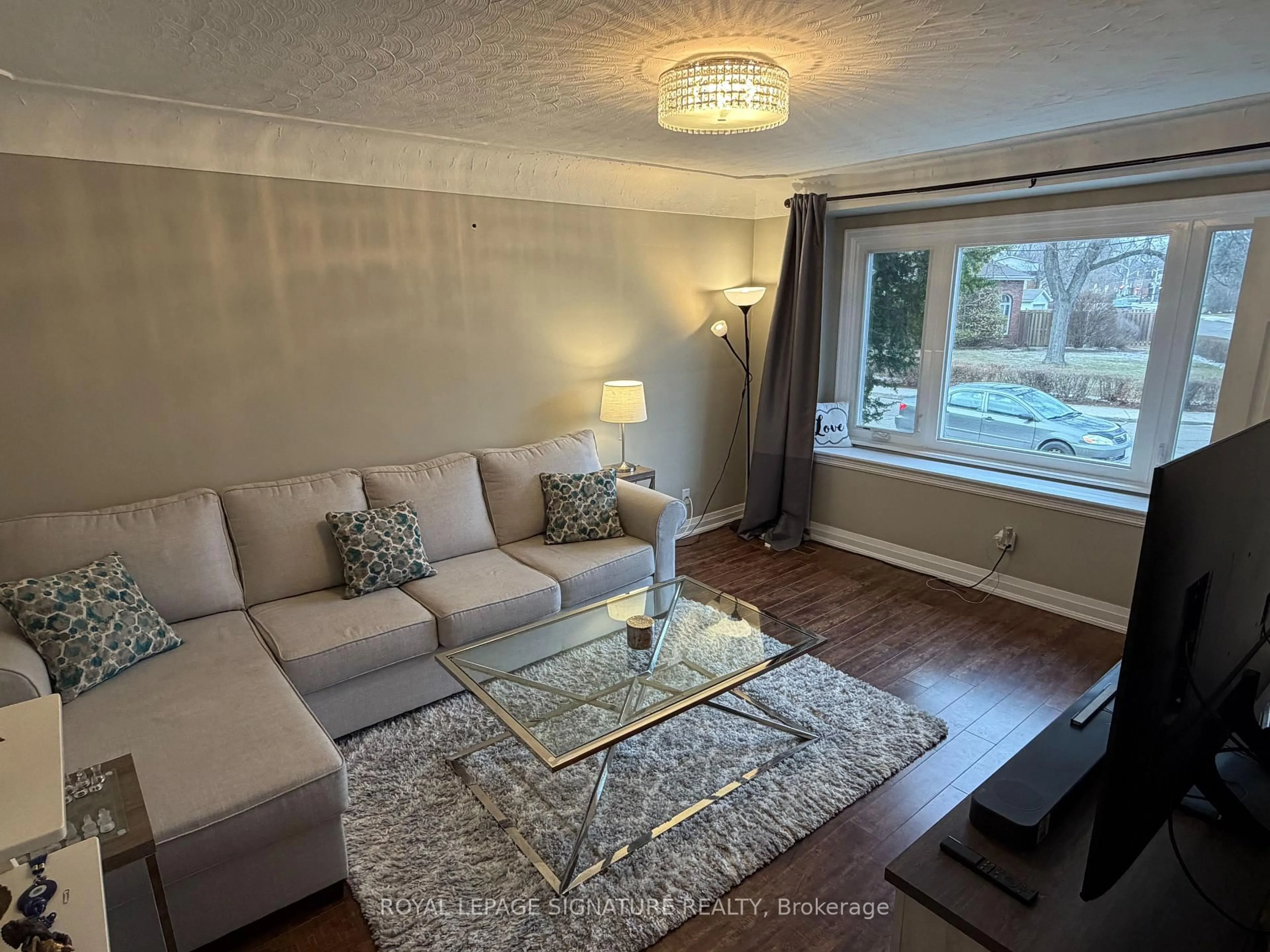 Living room with furniture, wood/laminate floor for 69 Glenmount Ave, Hamilton Ontario L8S 2L3