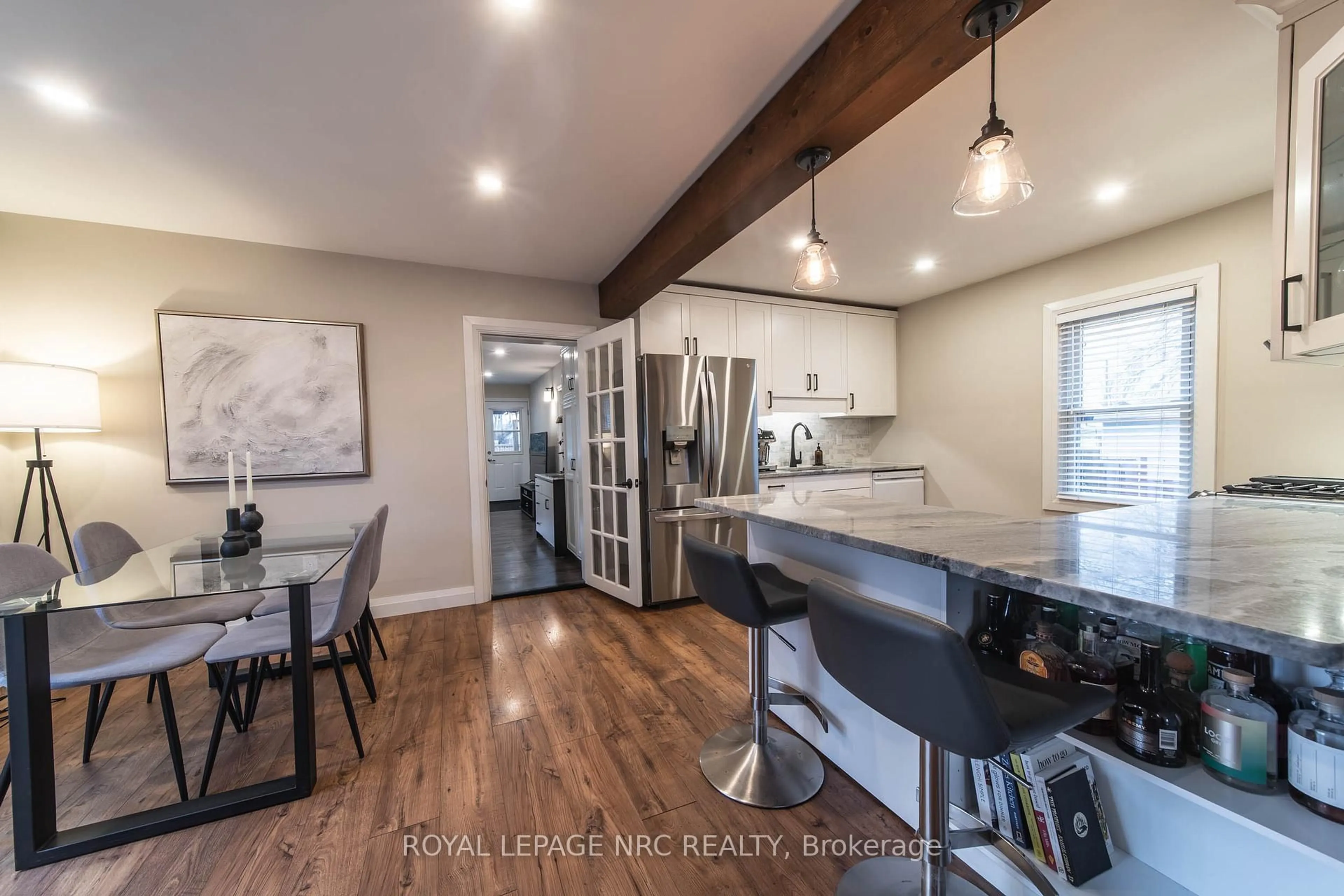 Open concept kitchen, wood/laminate floor for 5717 Morden Dr, Niagara Falls Ontario L2E 3C6