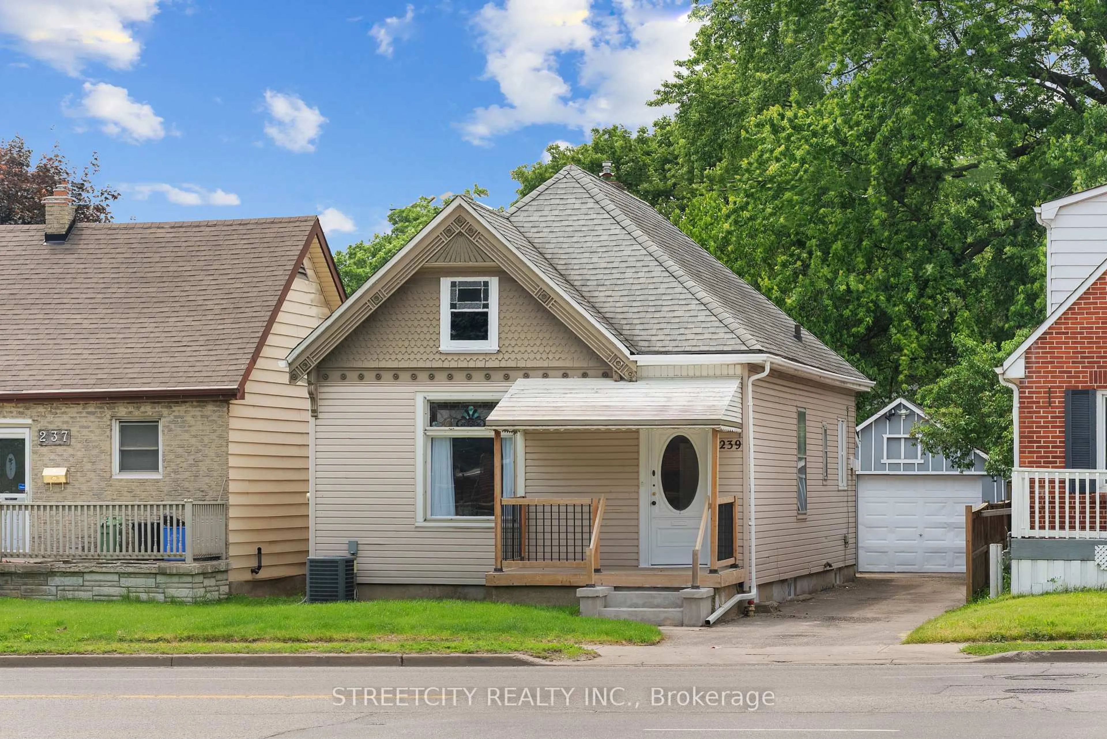 Home with vinyl exterior material, street for 239 Highbury Ave, London East Ontario N5Z 2W8