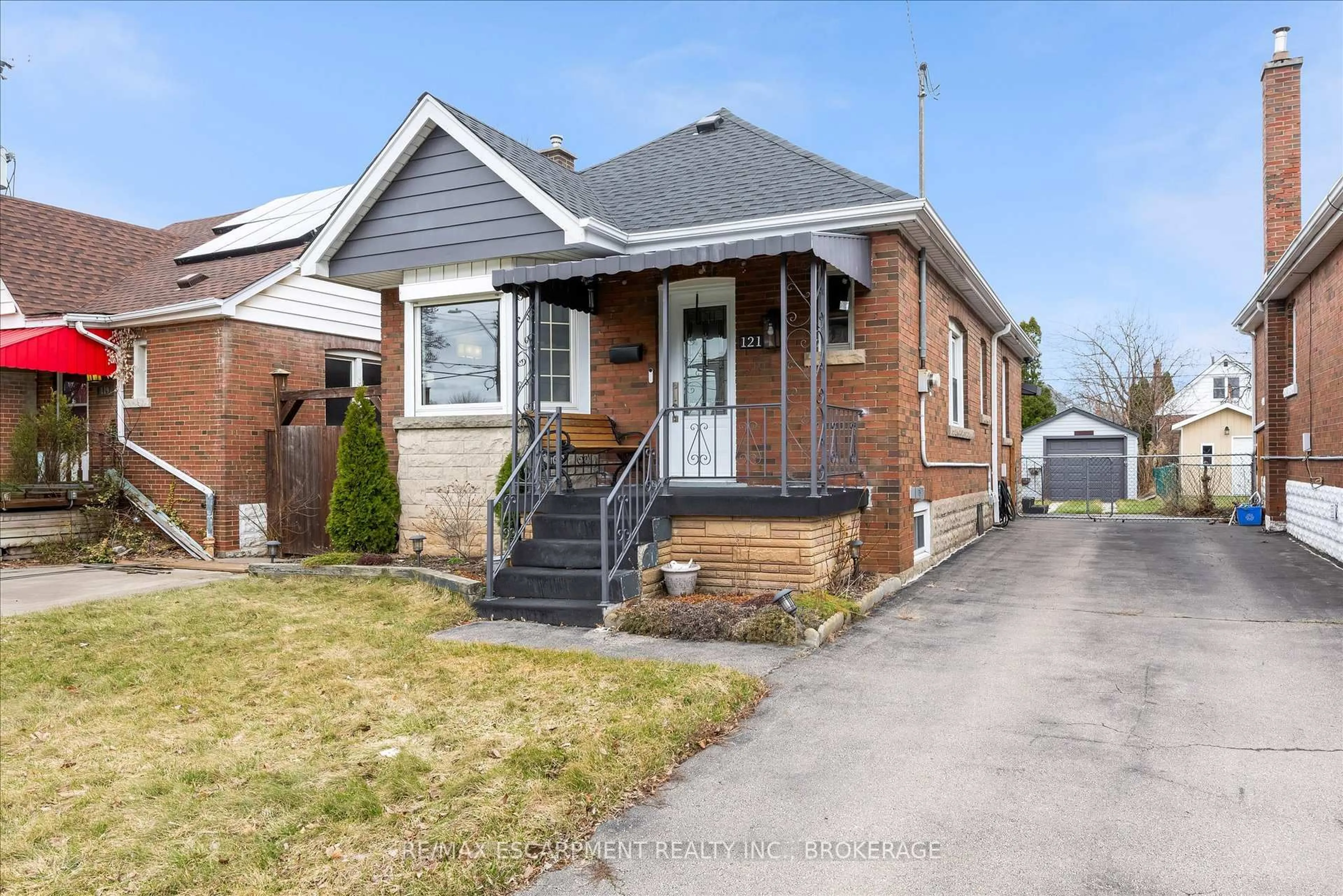 Home with brick exterior material, street for 121 Cameron Ave, Hamilton Ontario L8K 2X6