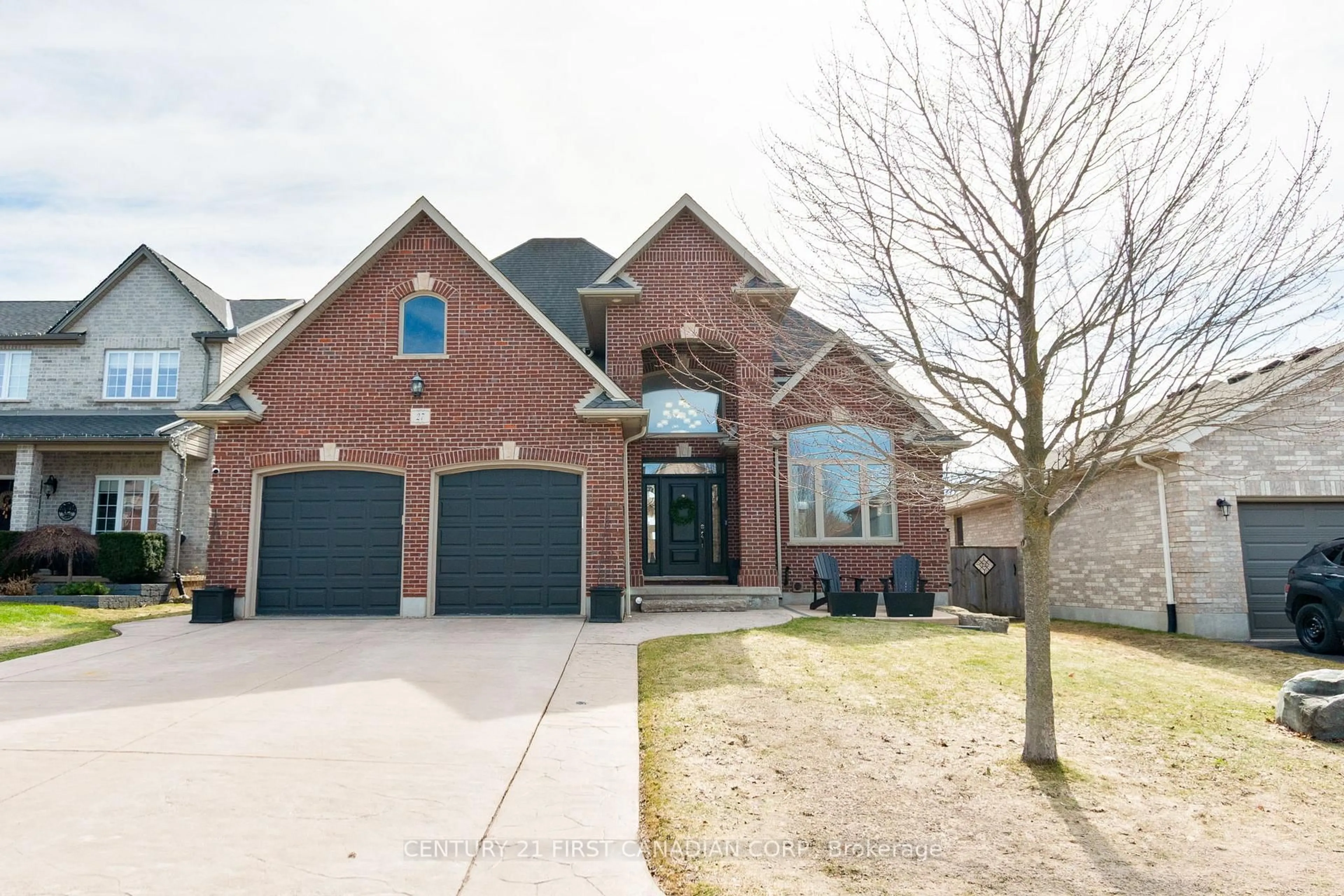 Home with brick exterior material, street for 27 Wood Lily Lane, Middlesex Centre Ontario N0M 2A0