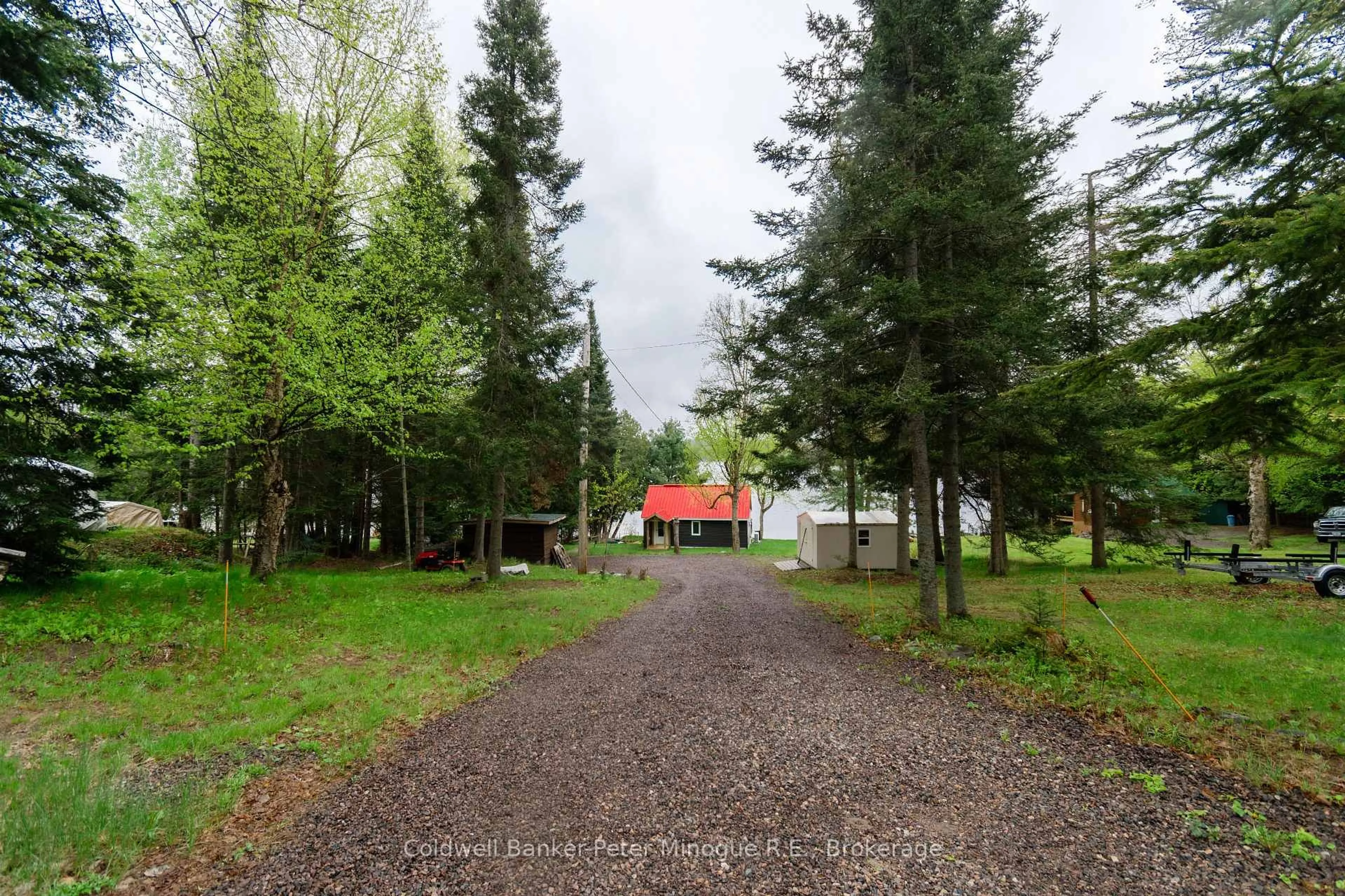 A pic from outside/outdoor area/front of a property/back of a property/a pic from drone, forest/trees view for 2261 Peninsula Rd, North Bay Ontario P1B 8G4