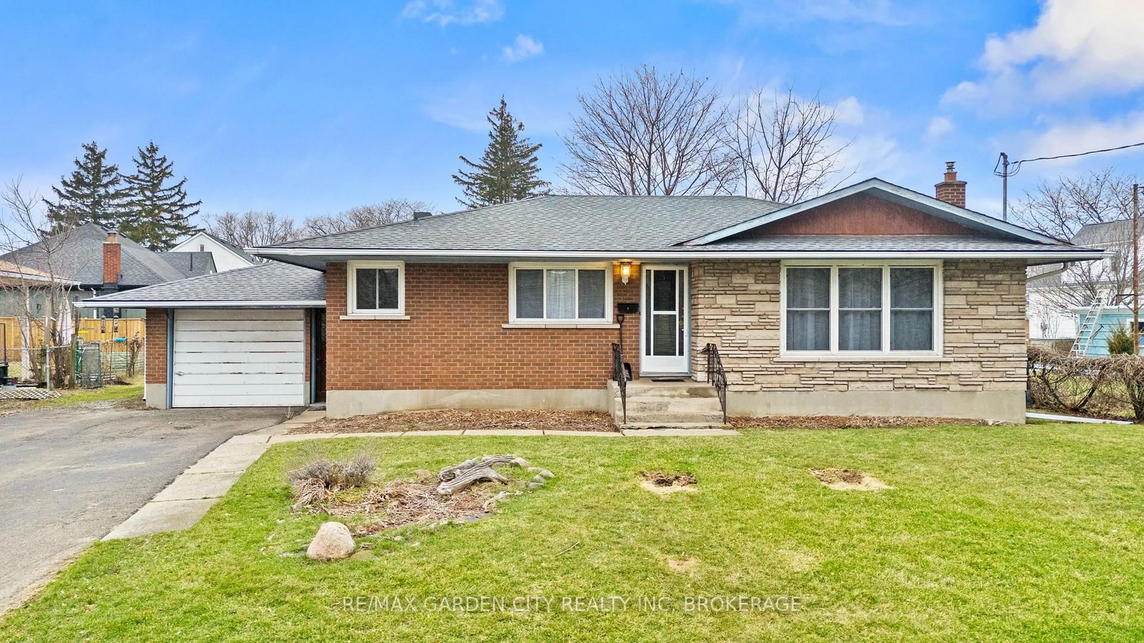 Home with brick exterior material, street for 1 GLADMAN Ave, St. Catharines Ontario L2N 4A2
