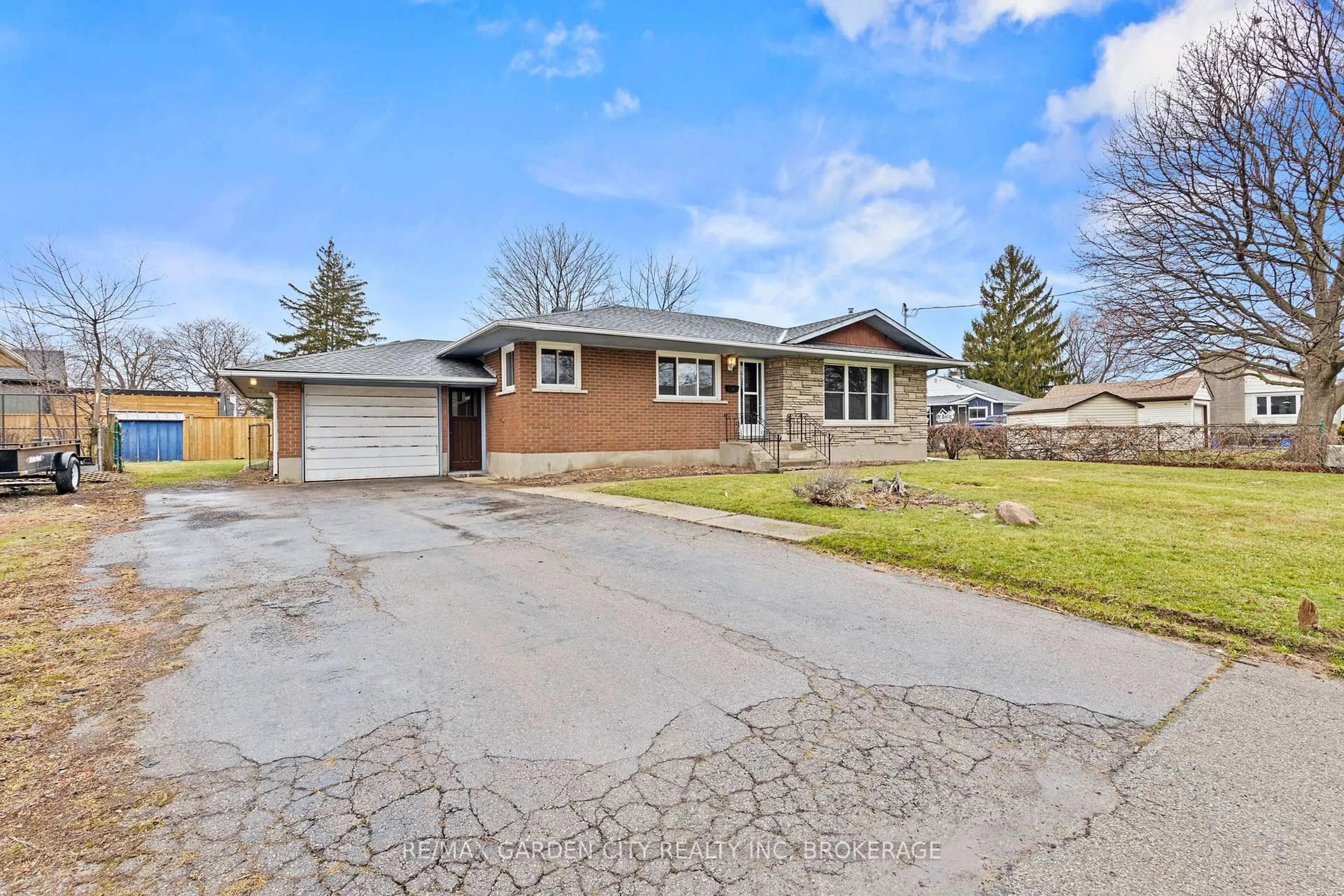 Home with brick exterior material, street for 1 GLADMAN Ave, St. Catharines Ontario L2N 4A2