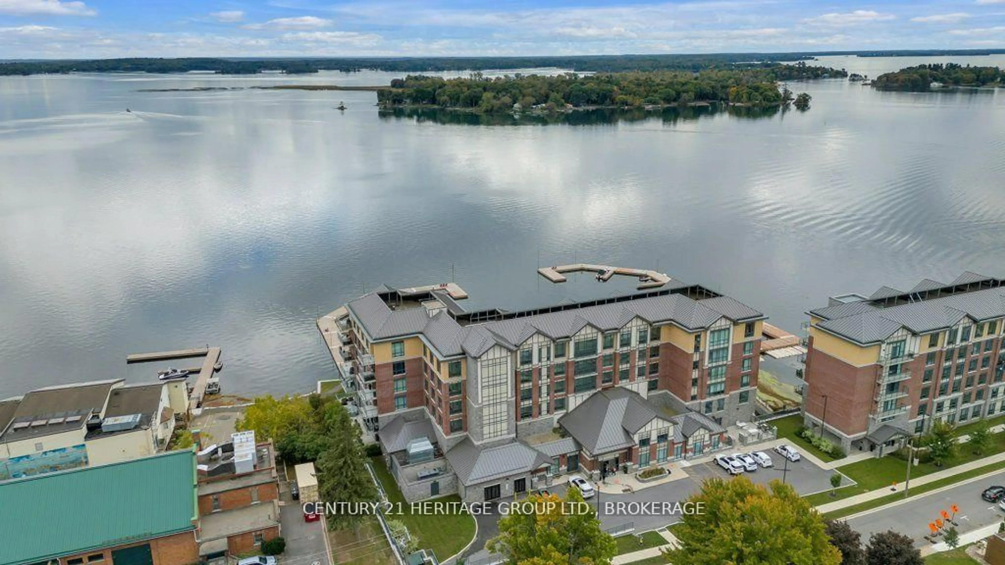 A pic from outside/outdoor area/front of a property/back of a property/a pic from drone, water/lake/river/ocean view for 129 South St #306, Gananoque Ontario K7G 1A1