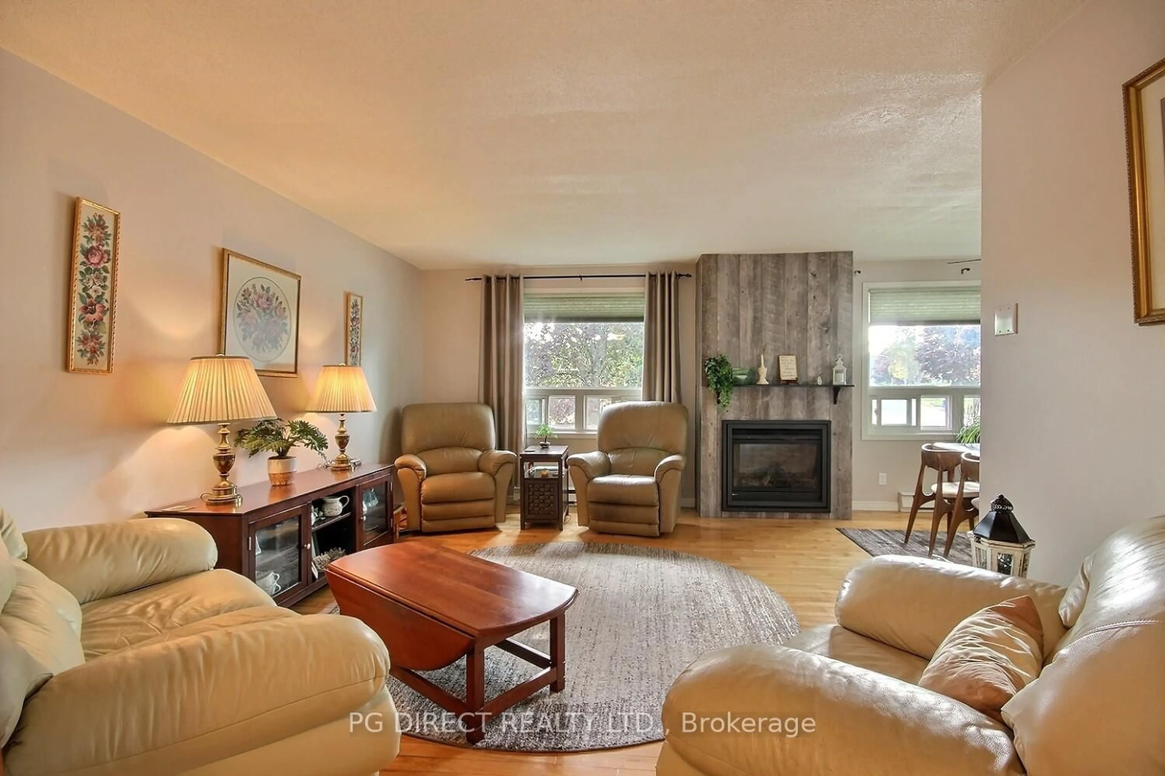 Living room with furniture, wood/laminate floor for 29 Patrick St, Quinte West Ontario K8V 4B4