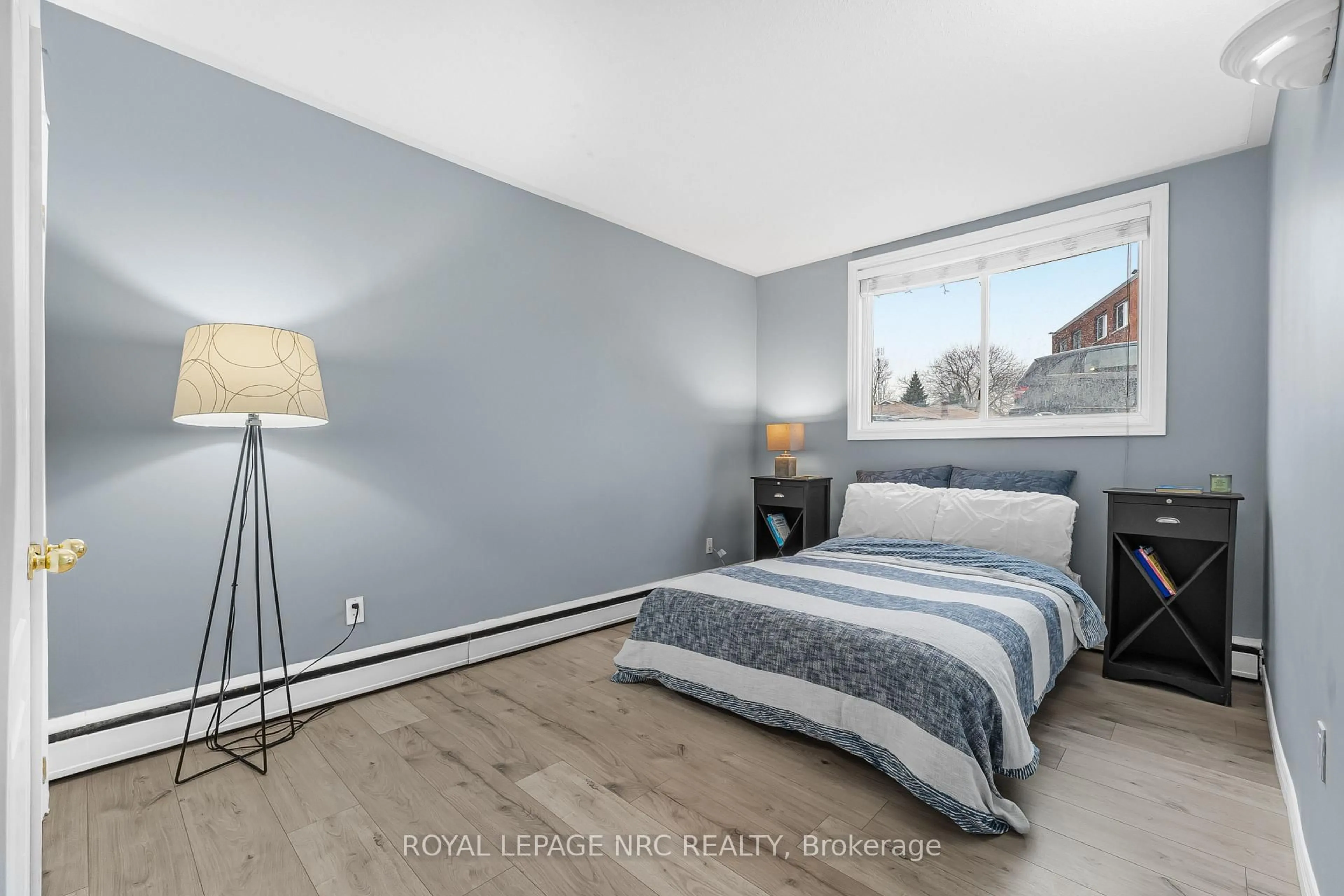 Bedroom with bed, wood/laminate floor for 454 CARLTON St #7, St. Catharines Ontario L2M 4X1