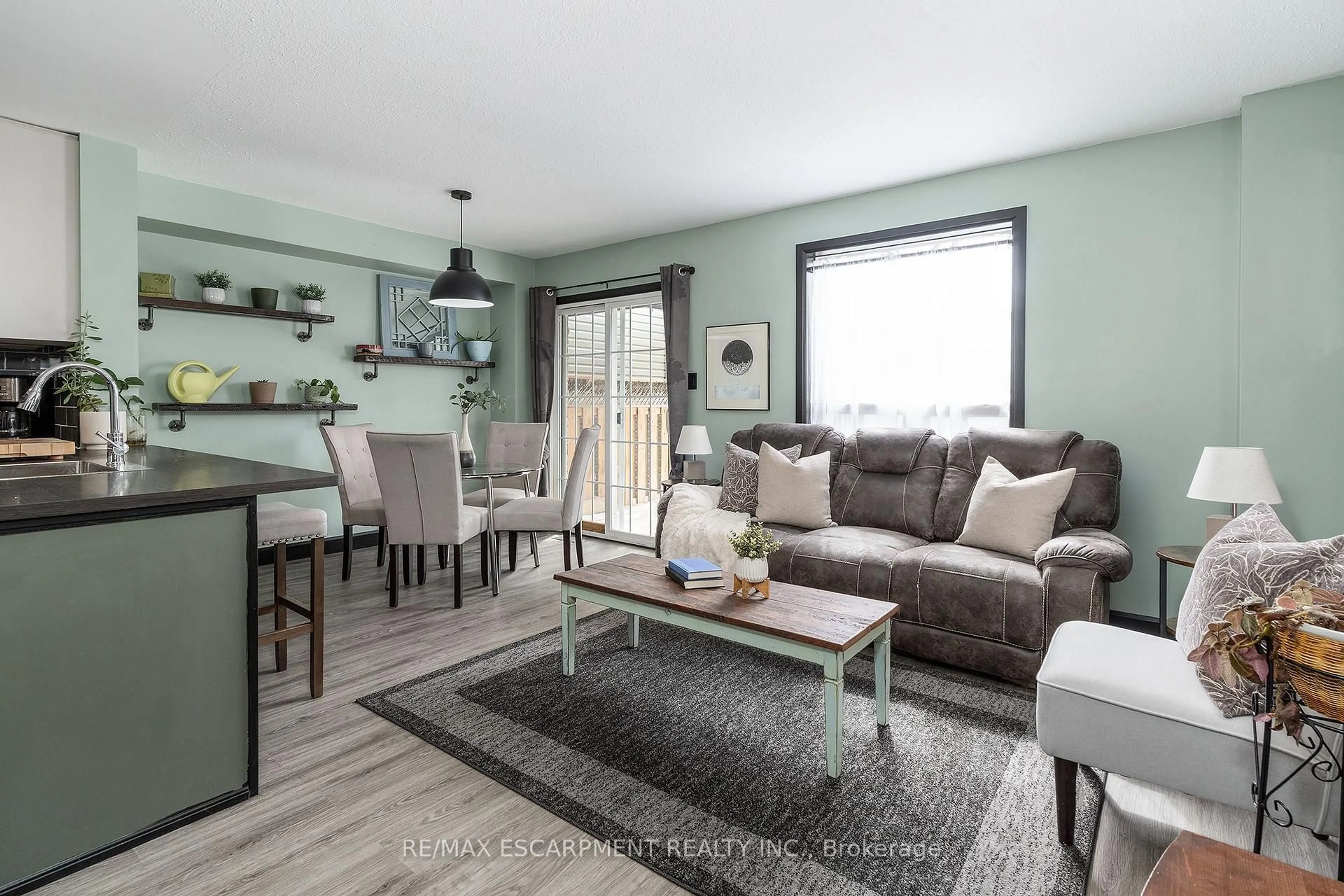Living room with furniture, wood/laminate floor for 80 Foxborough Dr, Hamilton Ontario L9G 4Y8