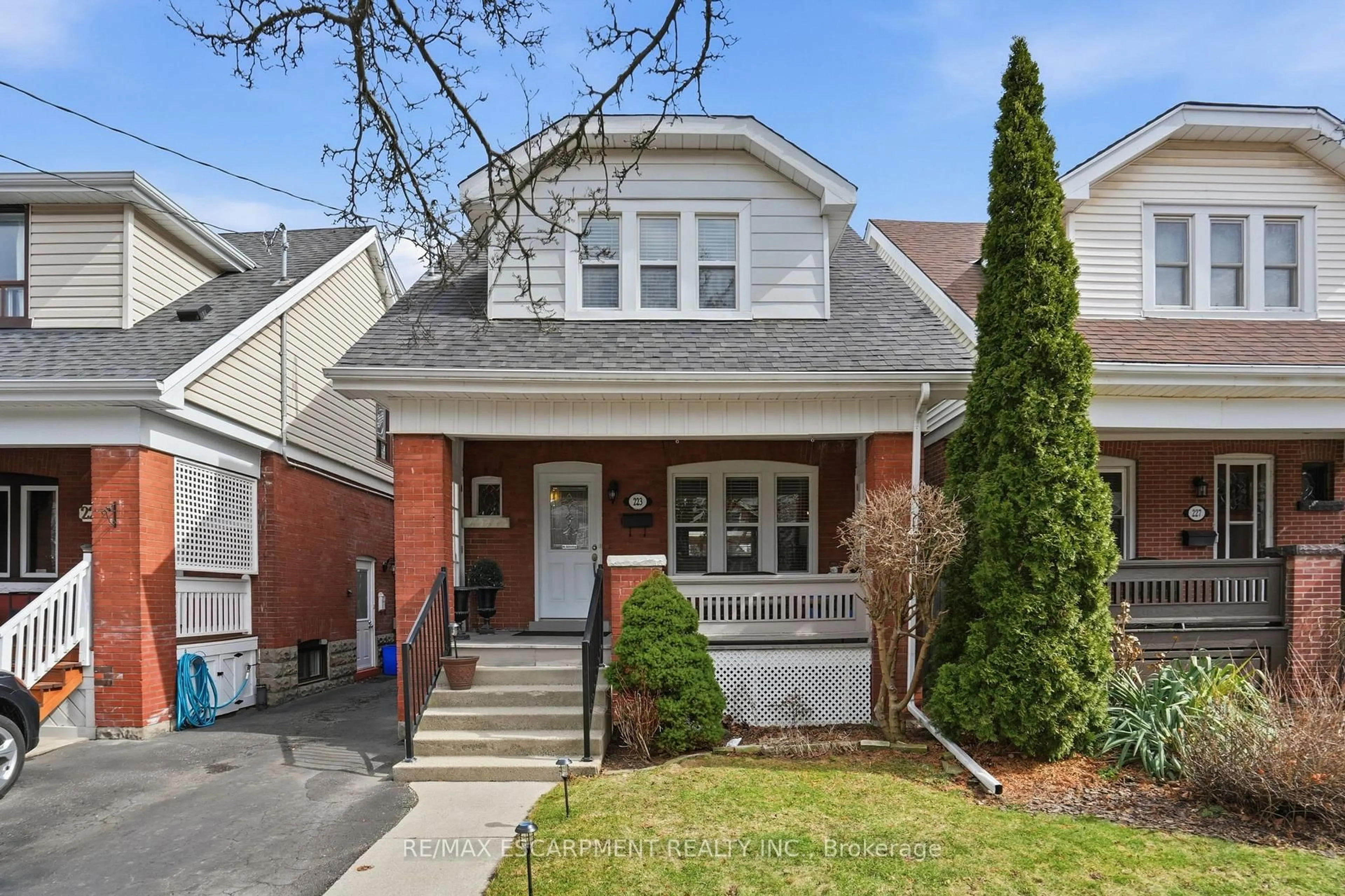 Home with brick exterior material, street for 223 Park Row, Hamilton Ontario L8K 2K4