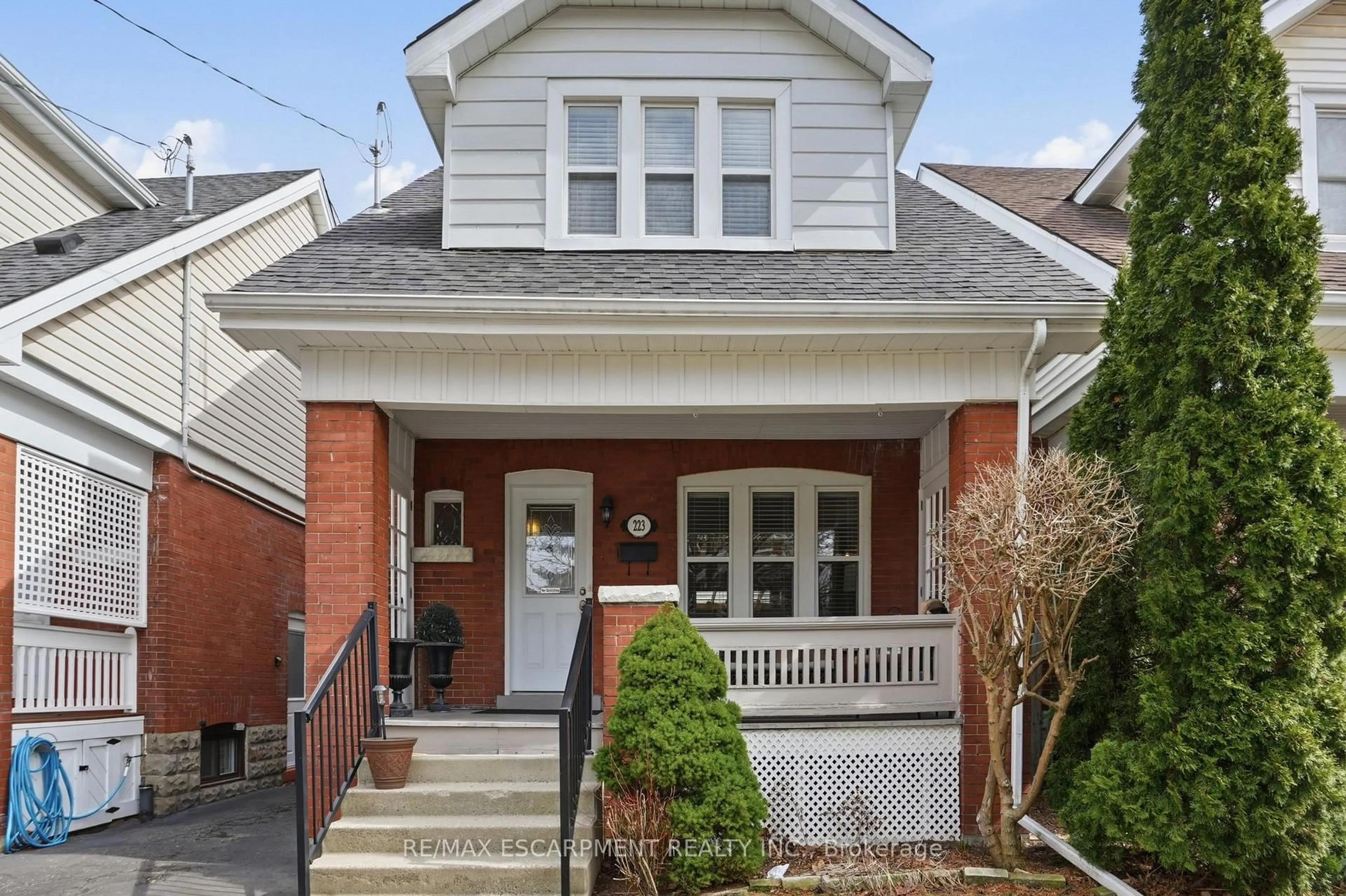 Home with brick exterior material, street for 223 Park Row, Hamilton Ontario L8K 2K4