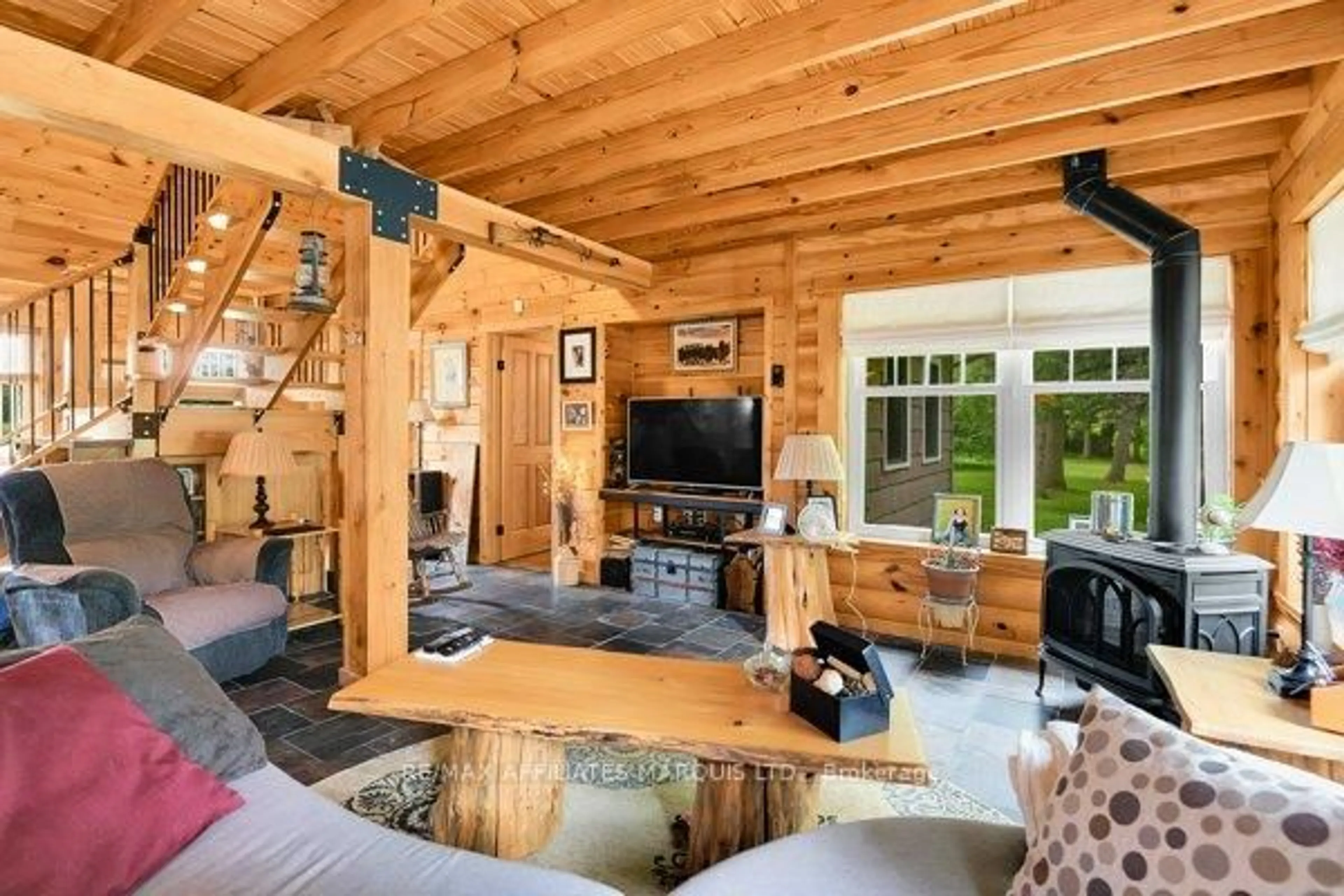 Living room with furniture, wood/laminate floor for 20158 Celtic Lane, South Glengarry Ontario K0C 1N0