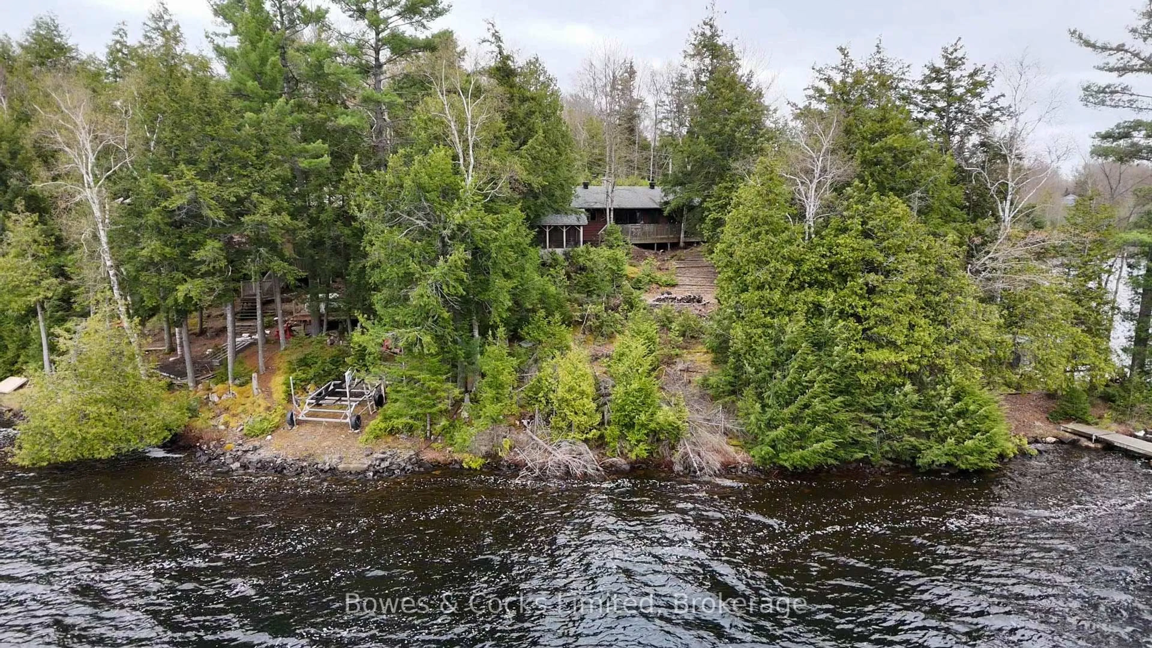 A pic from outside/outdoor area/front of a property/back of a property/a pic from drone, water/lake/river/ocean view for 187 Corral Post Lane, Coe Hill Ontario K0L 1P0