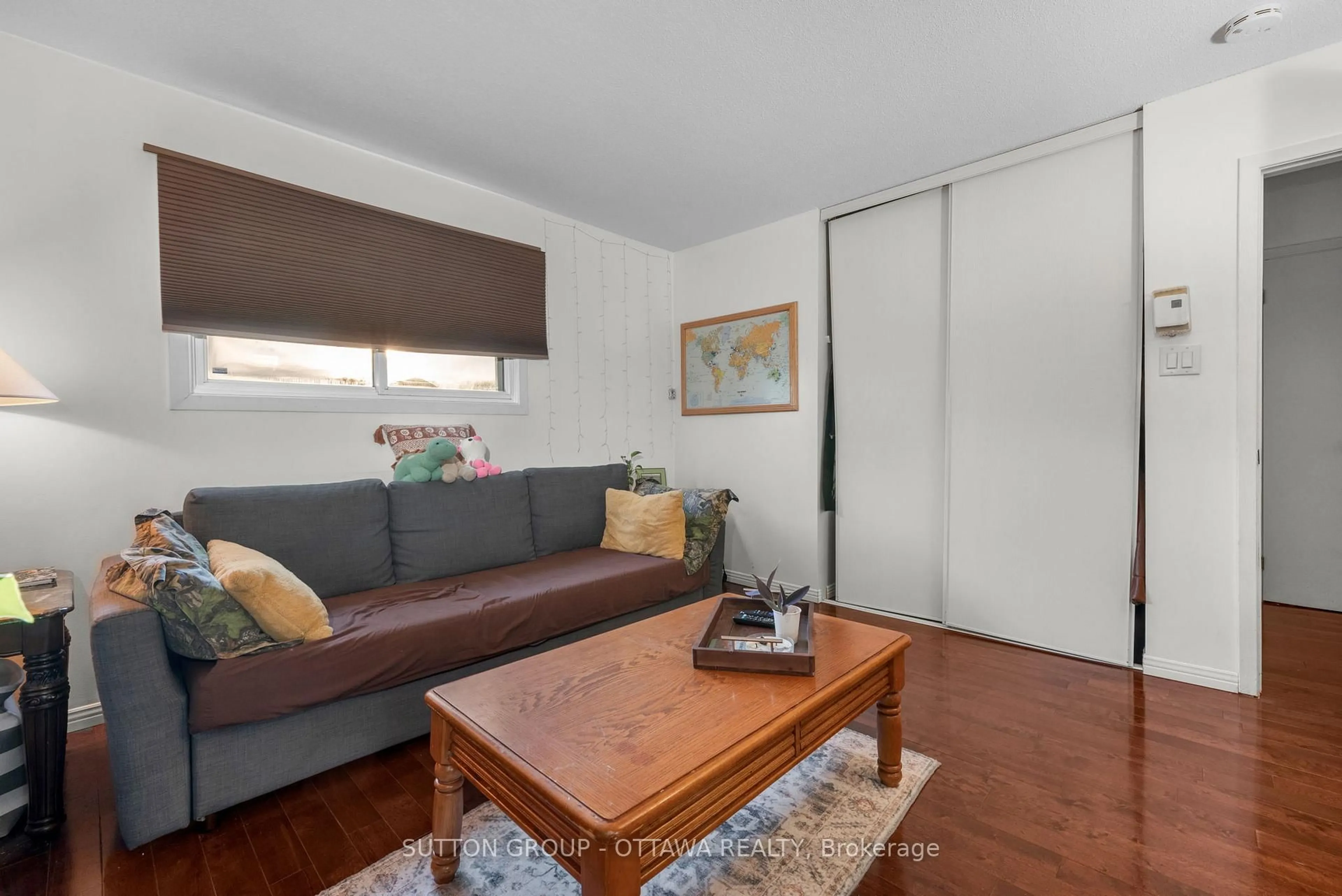 Living room with furniture, wood/laminate floor for 1150 St Pierre St, Orleans Ontario K1C 1L5