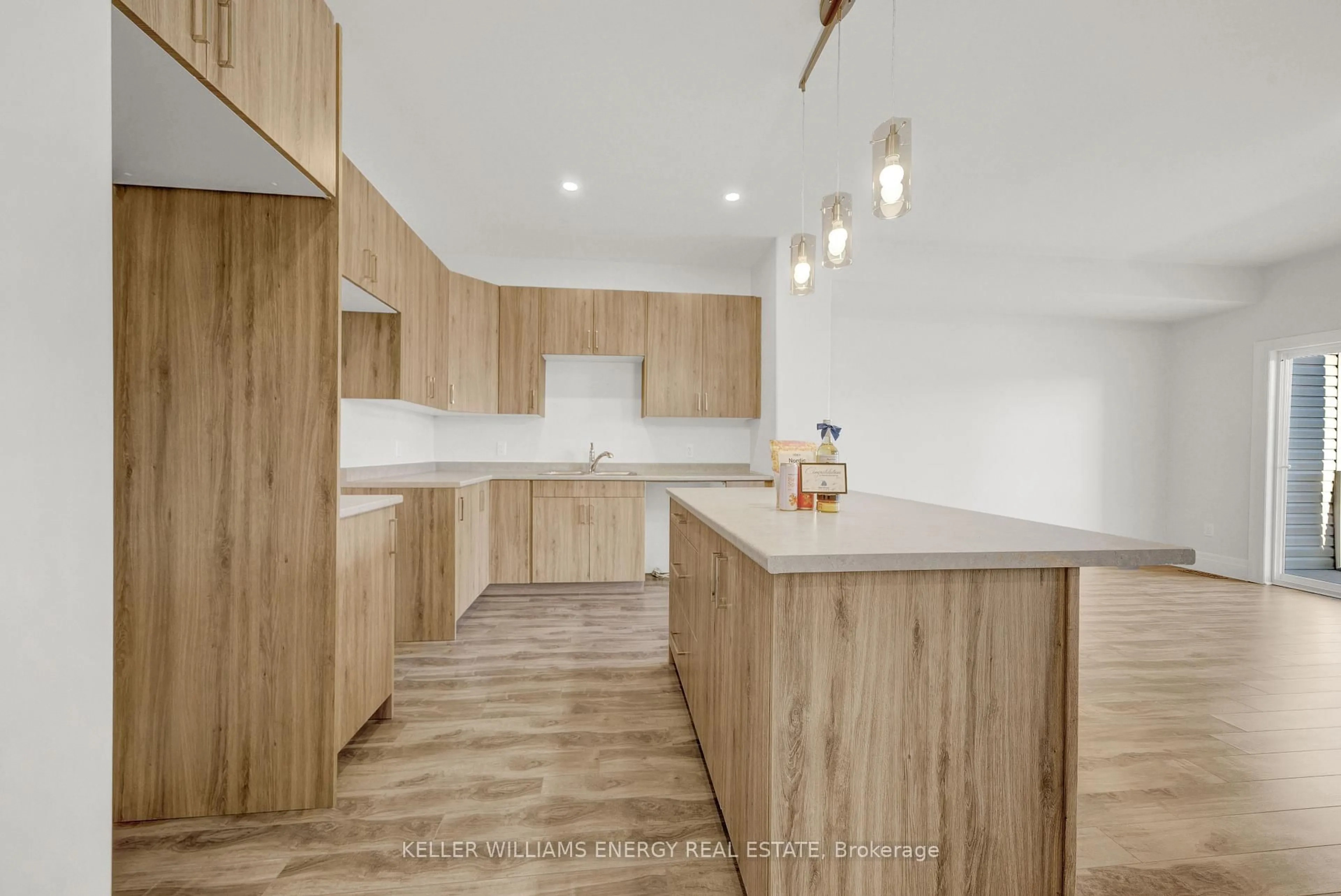 Open concept kitchen, wood/laminate floor for 17 Markland Ave, Prince Edward County Ontario K0K 2T0