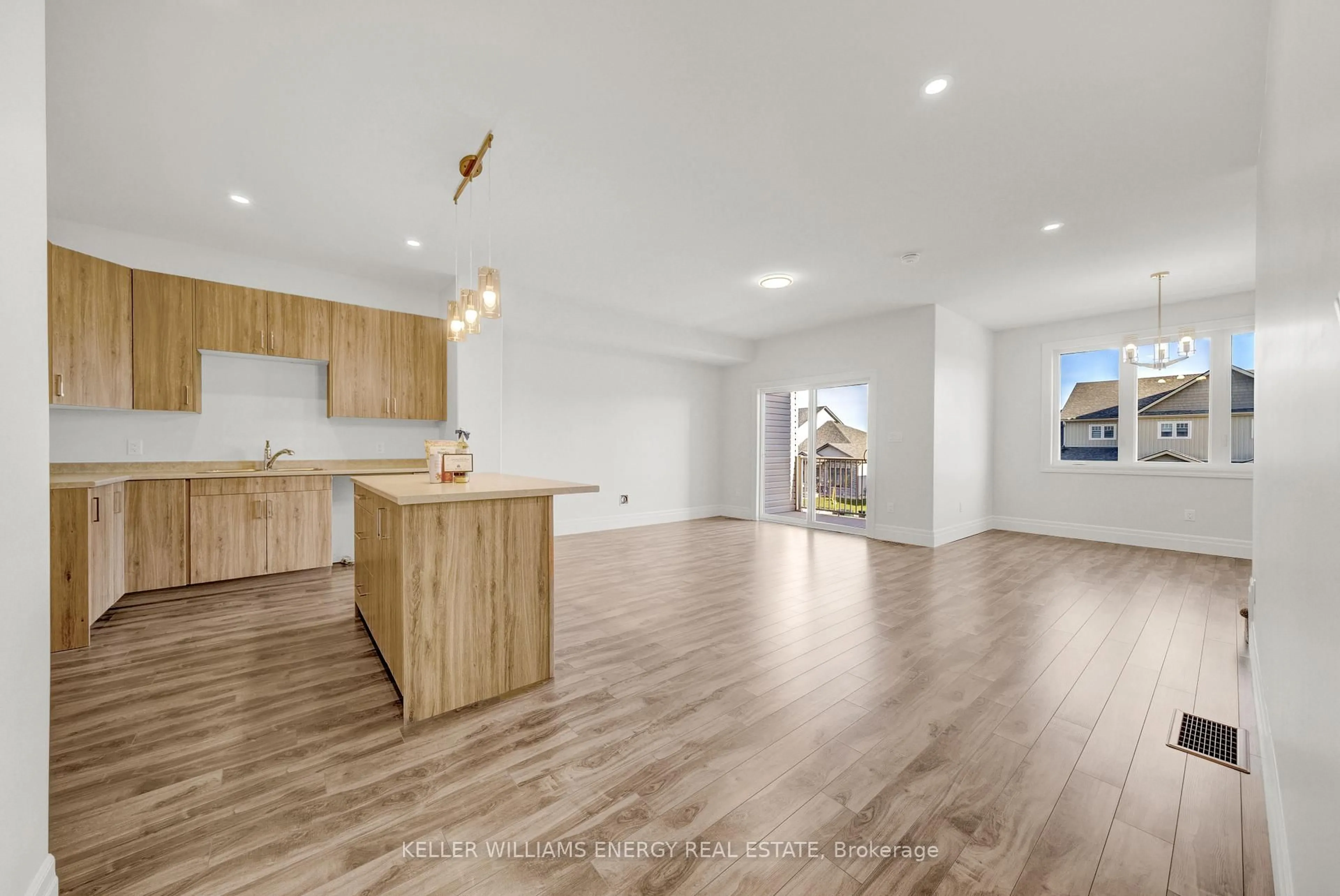 Open concept kitchen, wood/laminate floor for 17 Markland Ave, Prince Edward County Ontario K0K 2T0