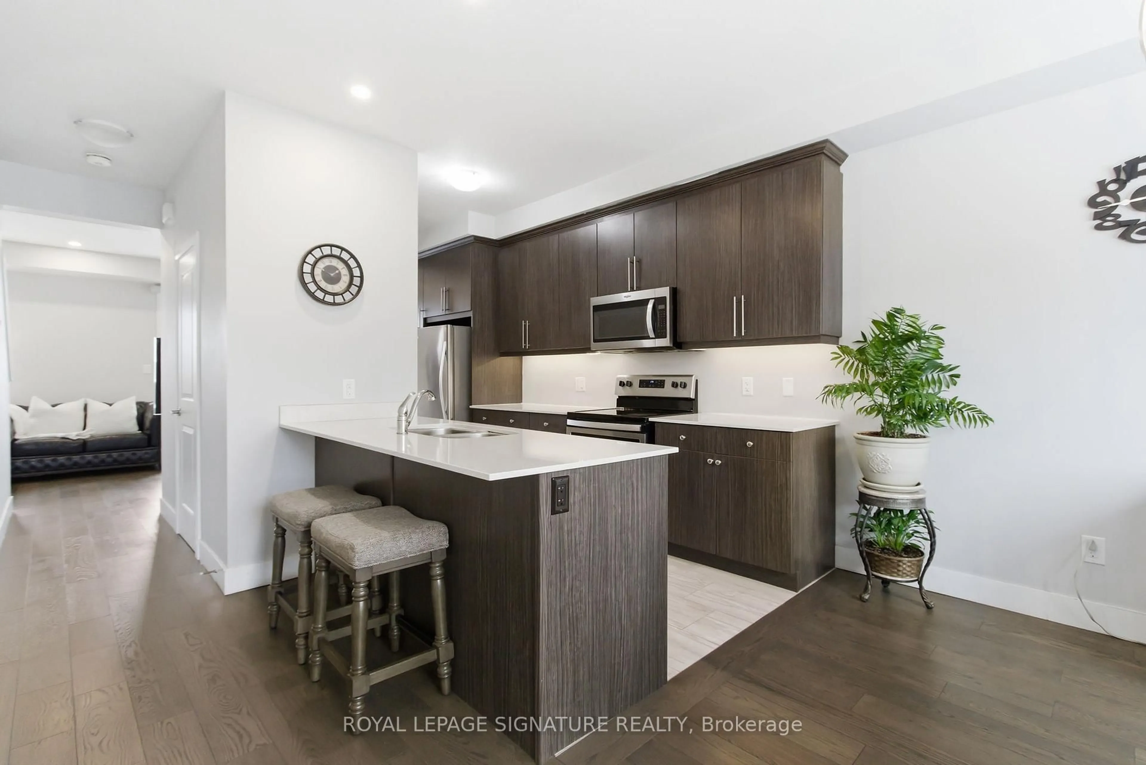 Open concept kitchen, wood/laminate floor for 2104 Meadowgate Blvd, London South Ontario N6M 0H5