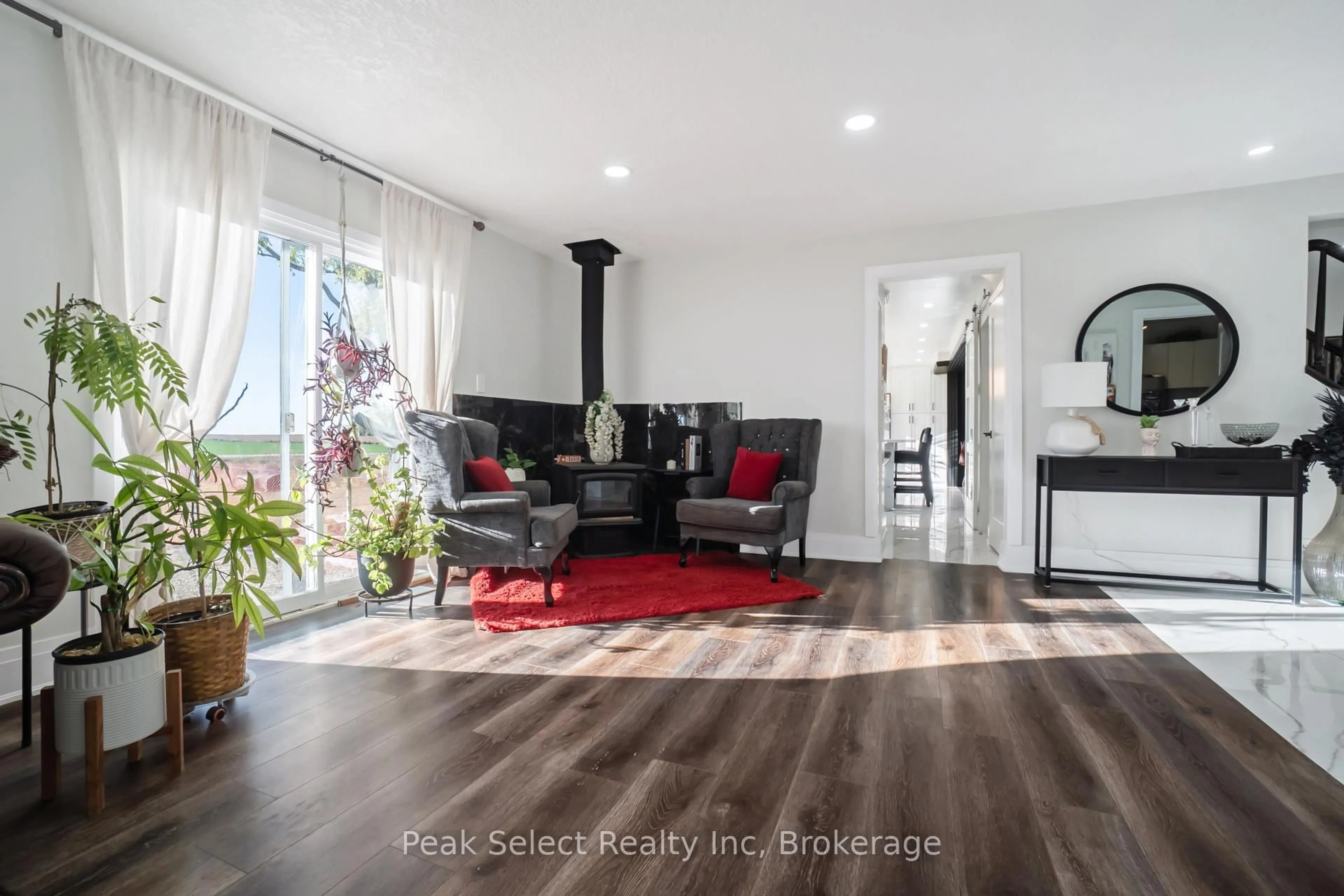 Living room with furniture, wood/laminate floor for 1982 Road 163, Perth South Ontario N4X 1C4