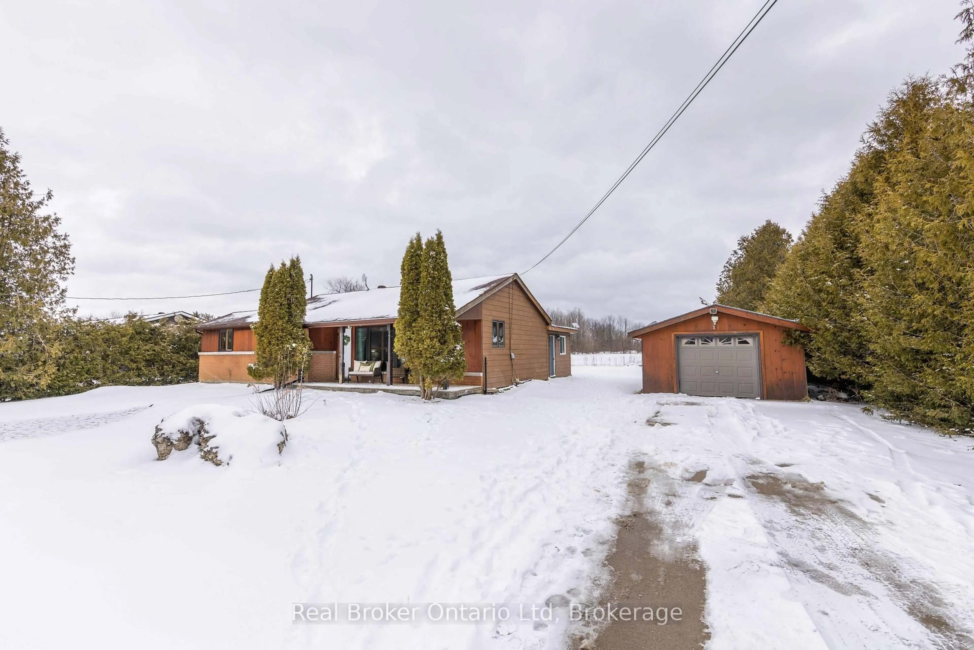 A pic from outside/outdoor area/front of a property/back of a property/a pic from drone, street for 122327 Grey 5 Rd, Georgian Bluffs Ontario N4K 5N5