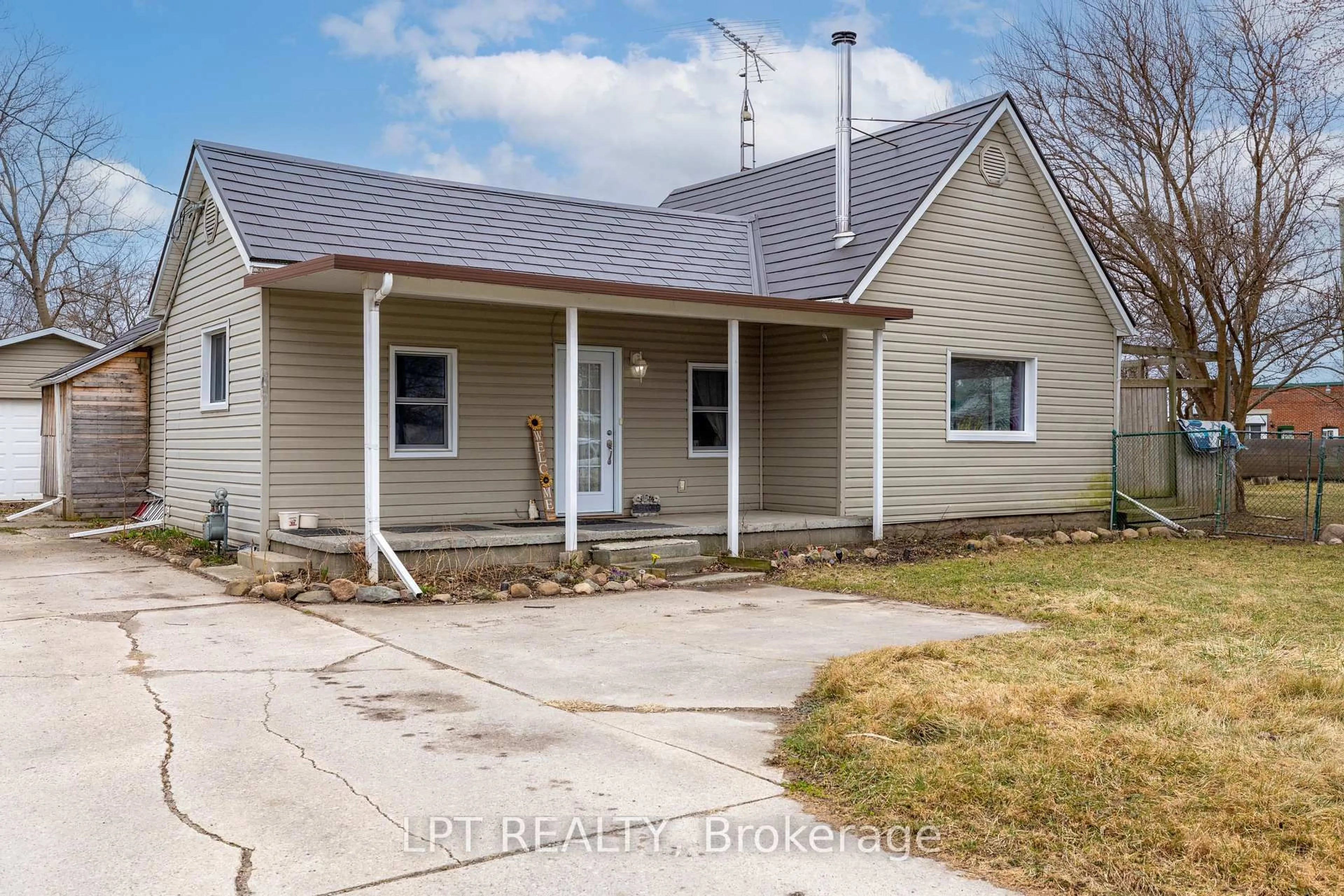 Home with vinyl exterior material, street for 19 John Park Line #Tupperville, Chatham-Kent Ontario N0P 2M0