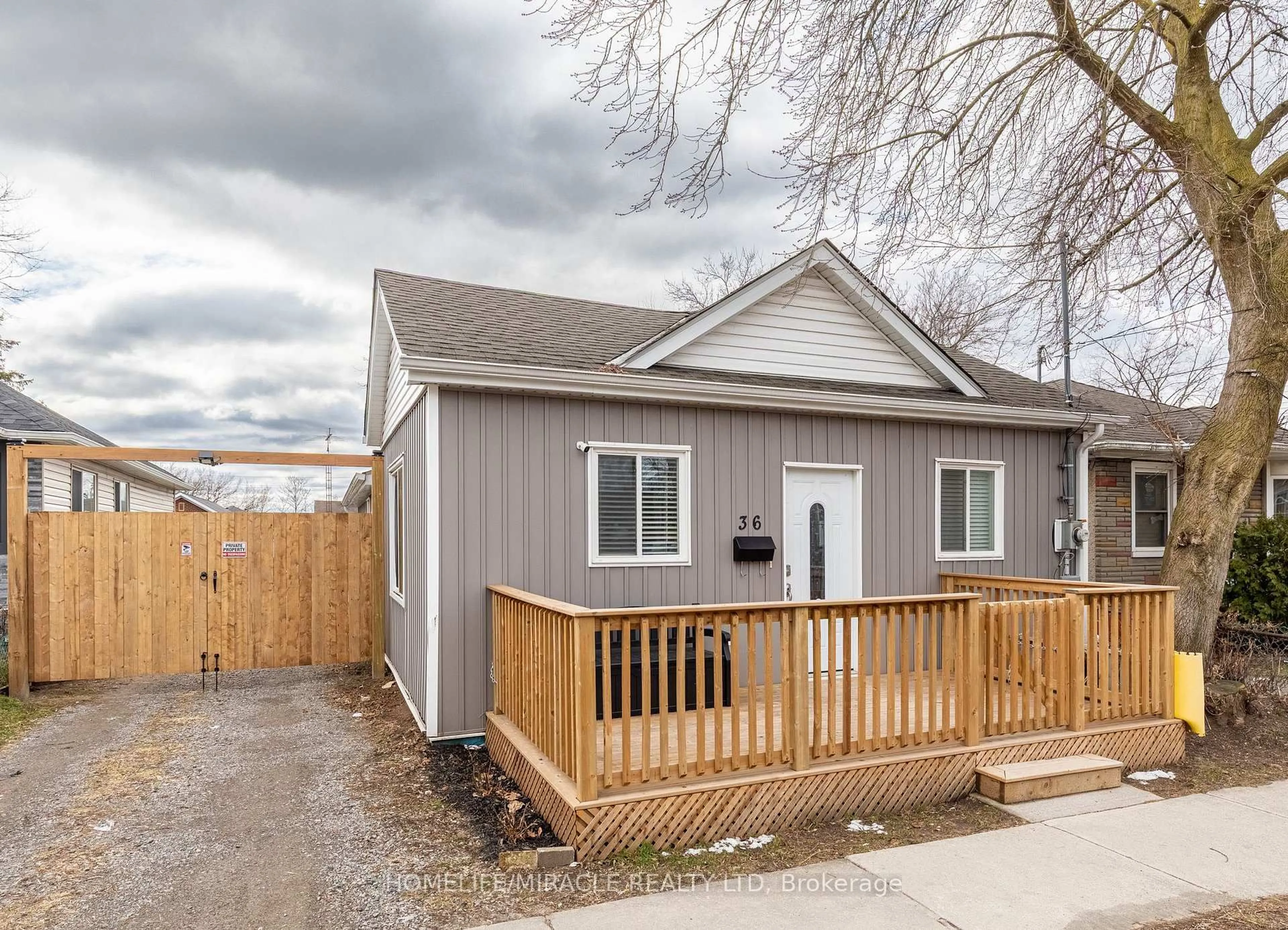 Home with vinyl exterior material, street for 36 Division St, St. Catharines Ontario L2R 3G2