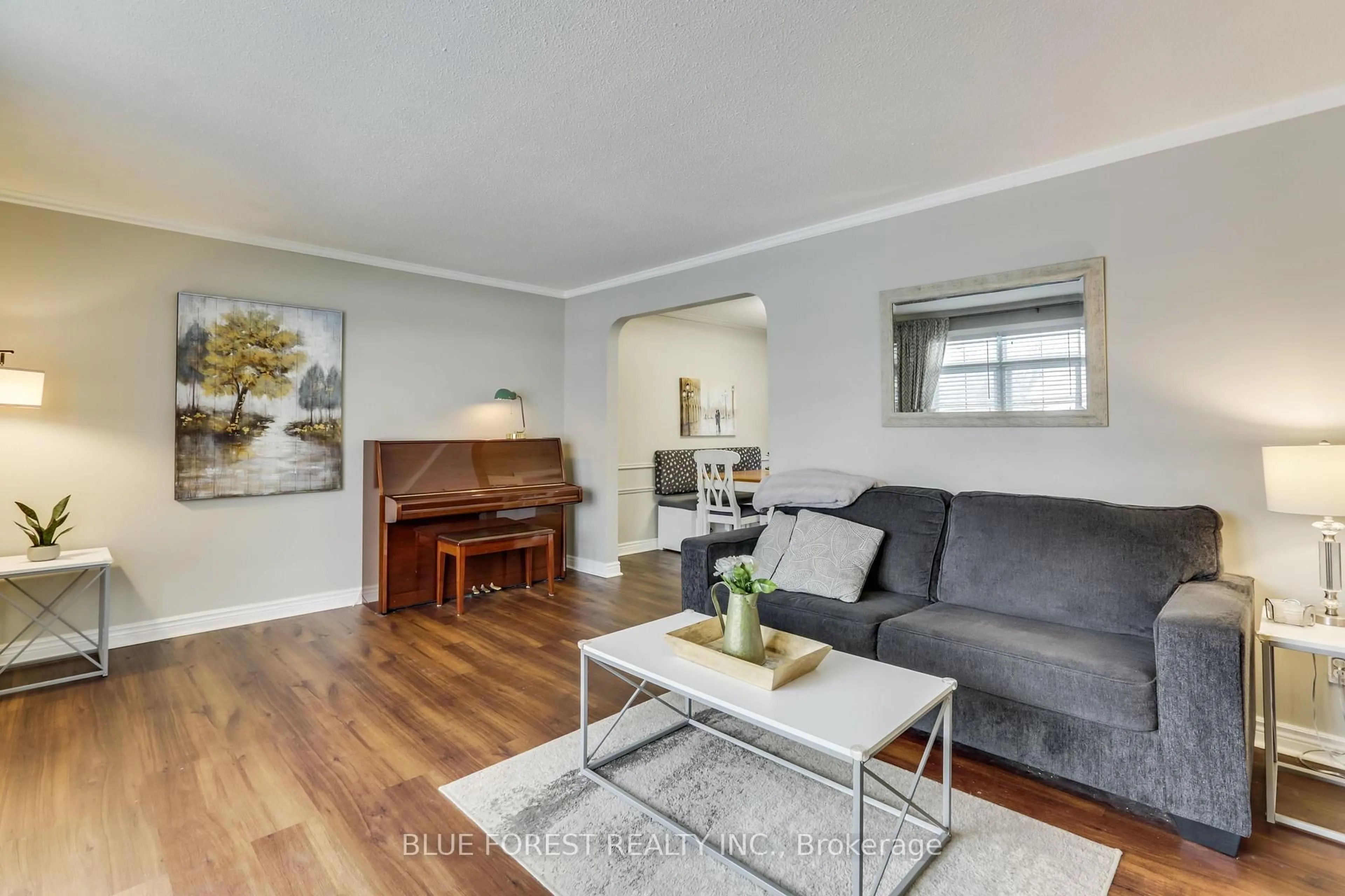 Living room with furniture, wood/laminate floor for 1089 Viscount Rd, London South Ontario N6K 1H9