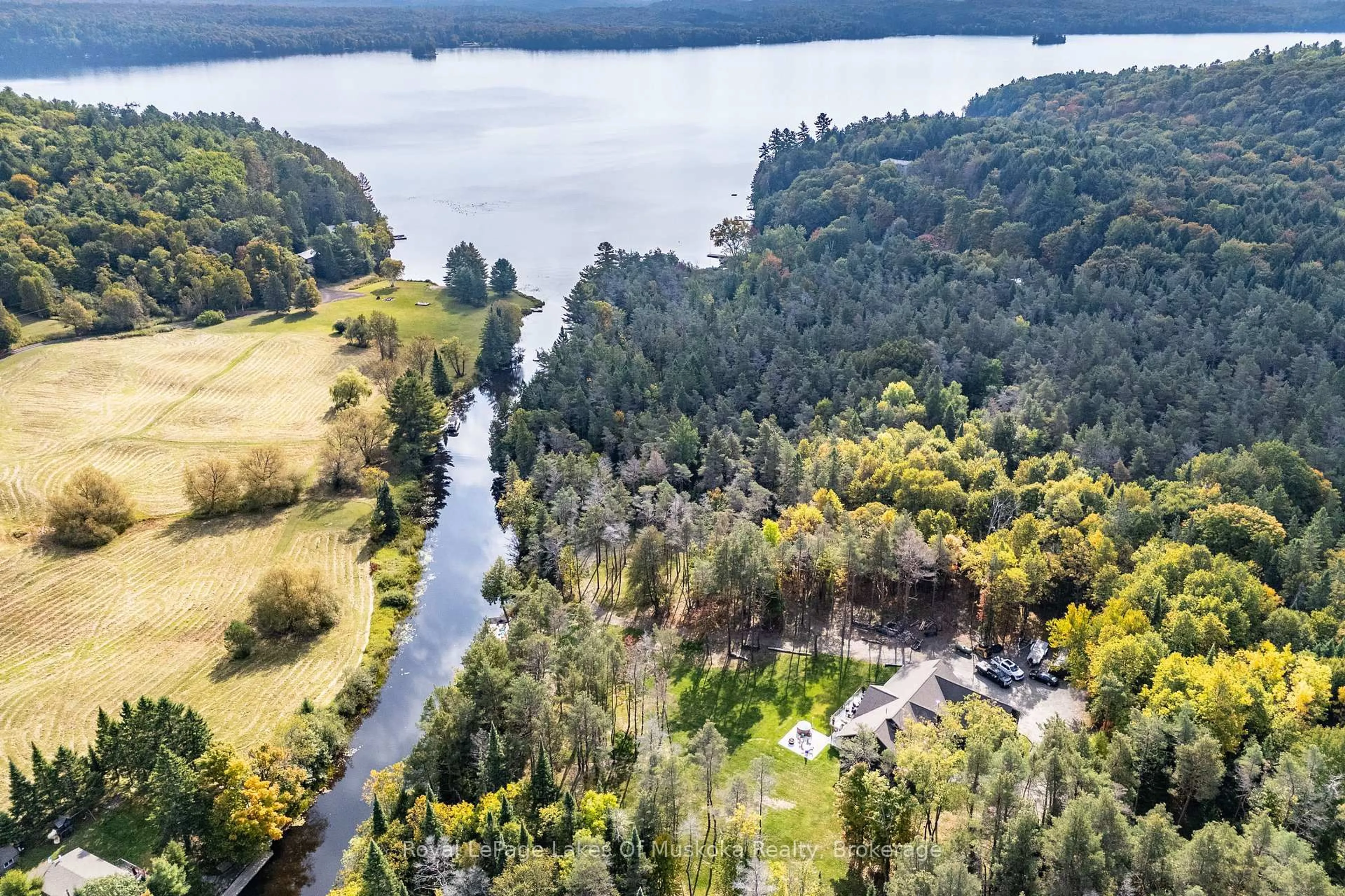 A pic from outside/outdoor area/front of a property/back of a property/a pic from drone, water/lake/river/ocean view for 461 Rowanwood Rd, Huntsville Ontario P0B 1M0