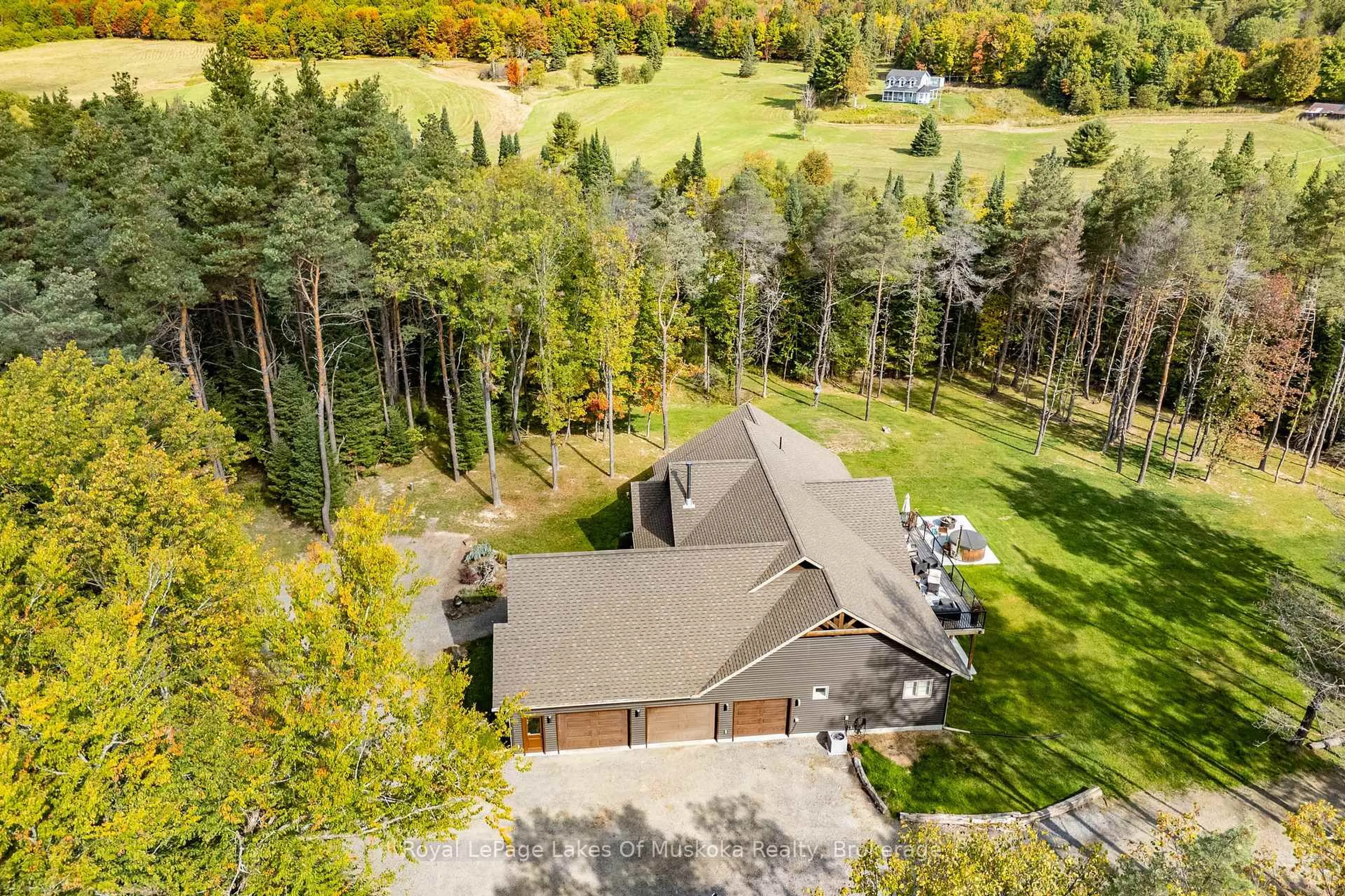 A pic from outside/outdoor area/front of a property/back of a property/a pic from drone, forest/trees view for 461 Rowanwood Rd, Huntsville Ontario P0B 1M0