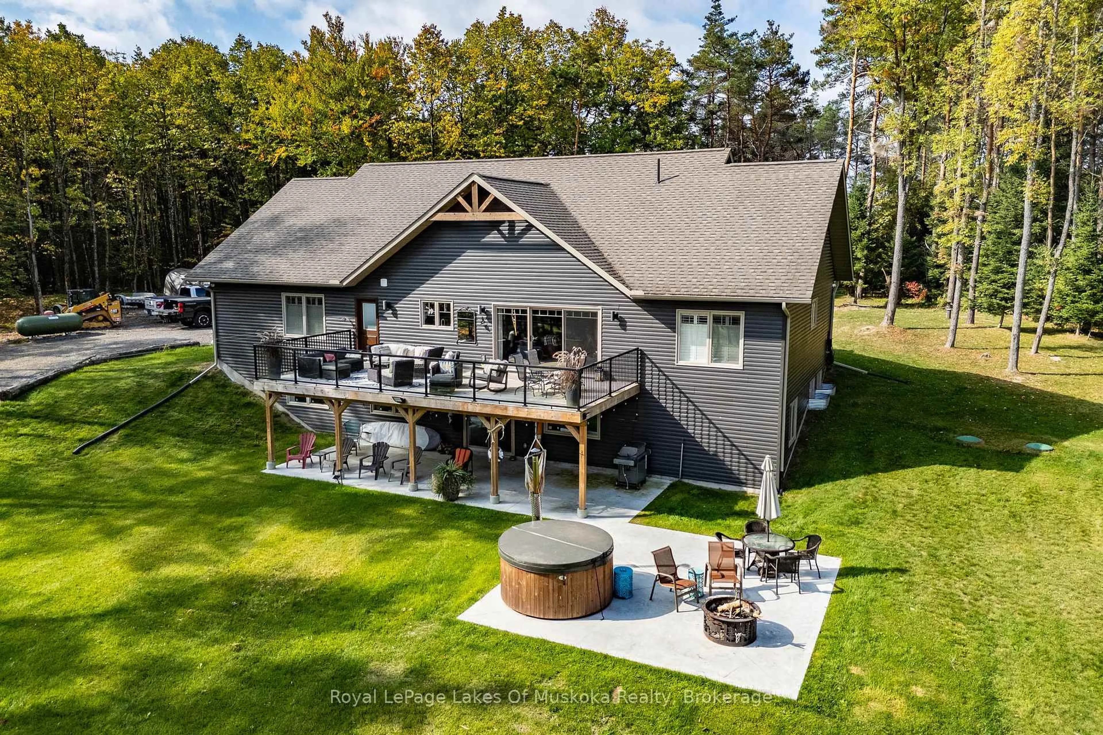 A pic from outside/outdoor area/front of a property/back of a property/a pic from drone, water/lake/river/ocean view for 461 Rowanwood Rd, Huntsville Ontario P0B 1M0
