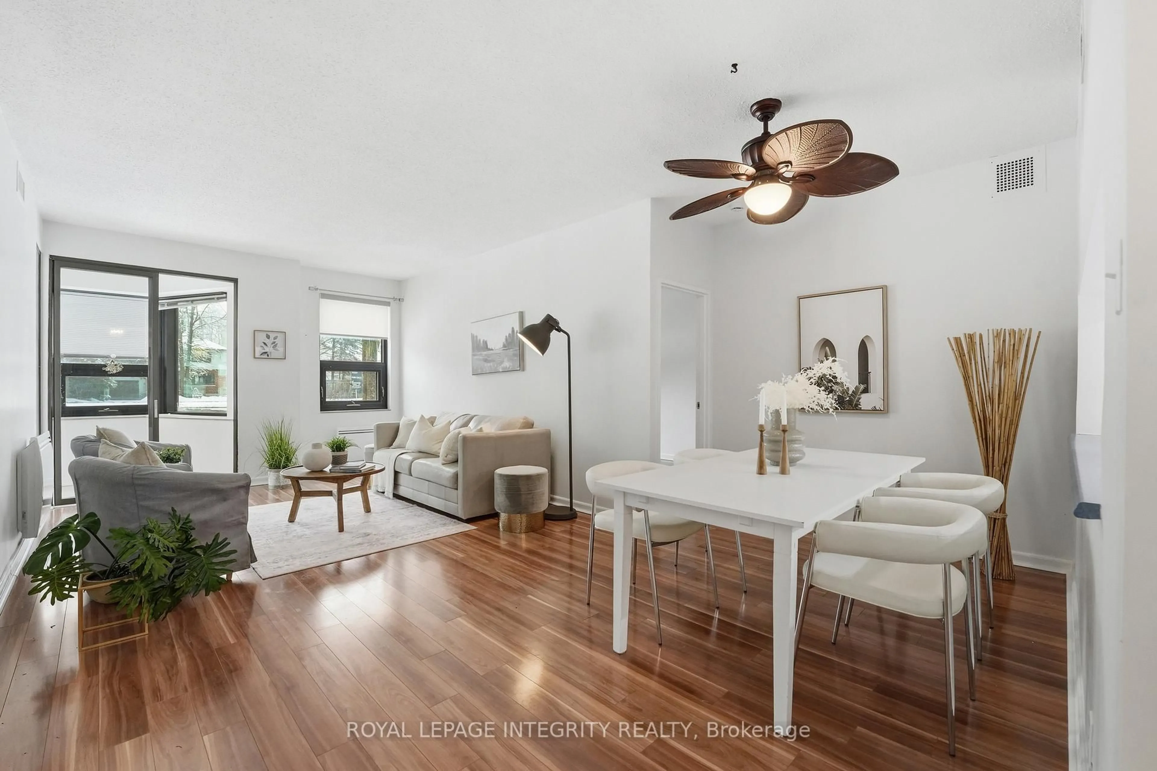 Living room with furniture, wood/laminate floor for 2019 Carling Ave #108, Ottawa Ontario K2A 4A2