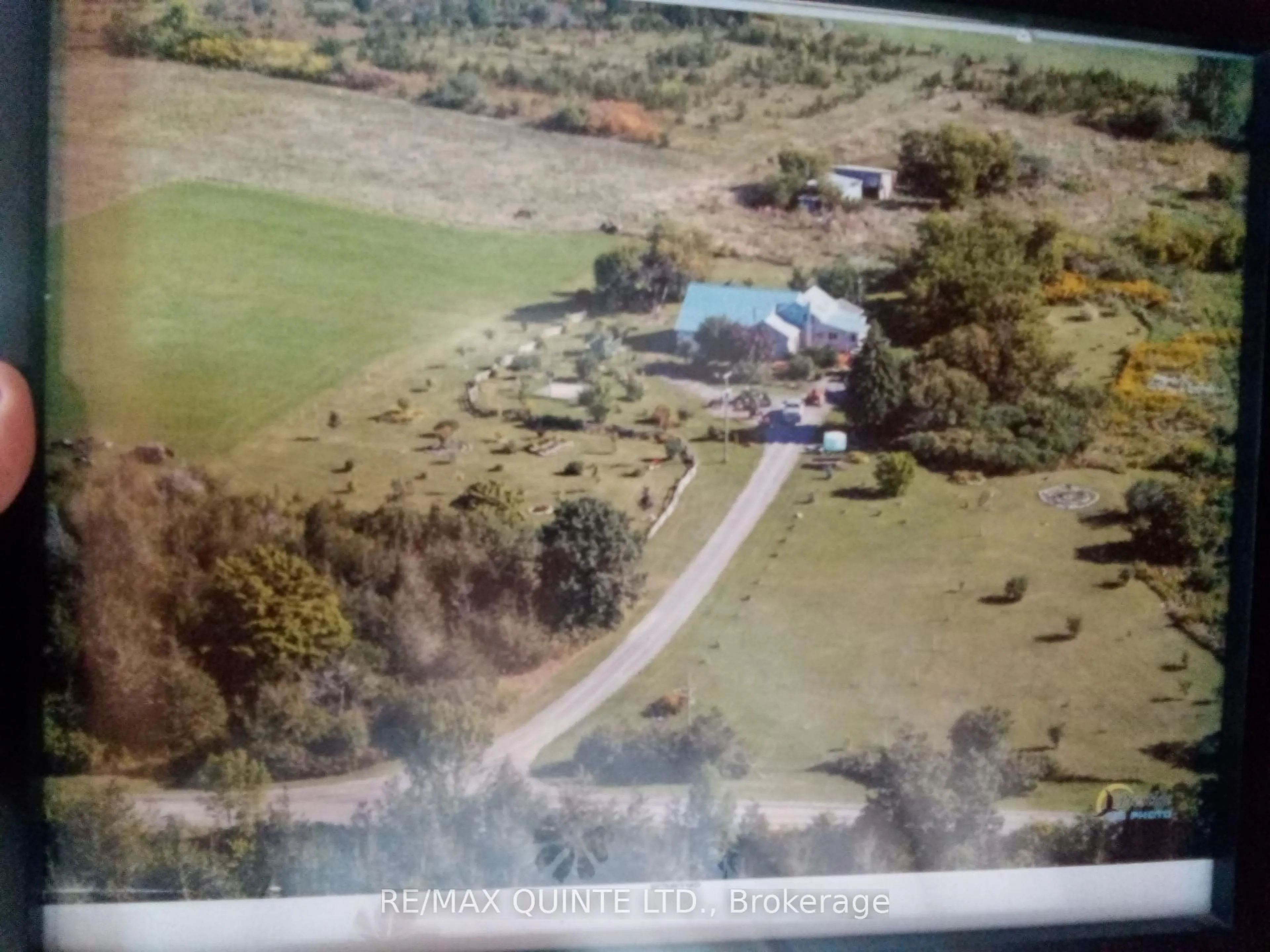 A pic from outside/outdoor area/front of a property/back of a property/a pic from drone, unknown for 159 Simpson Rd, Prince Edward County Ontario K0K 1P0