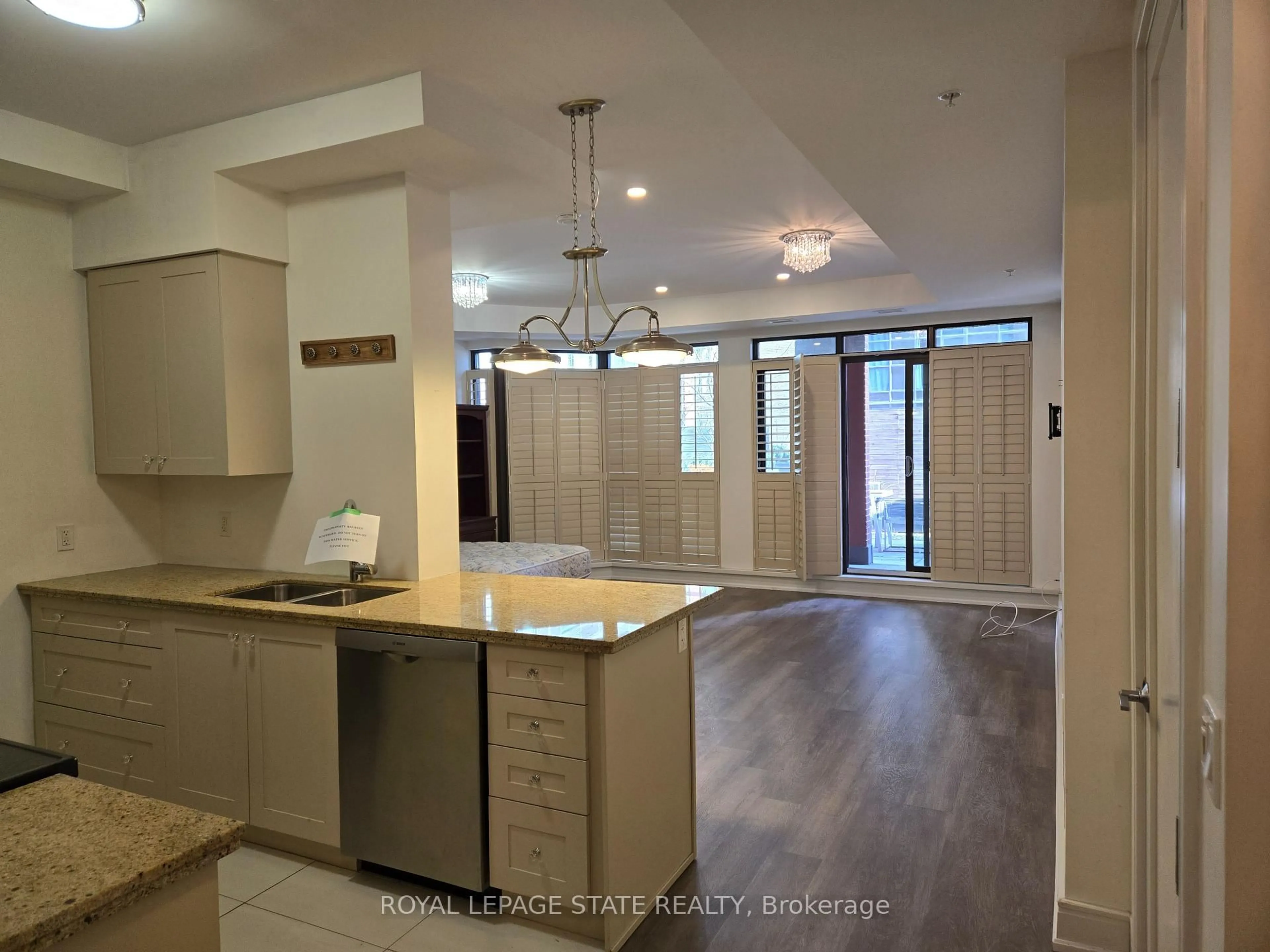 Open concept kitchen, ceramic/tile floor for 112 King St #410, Hamilton Ontario L8N 1A8