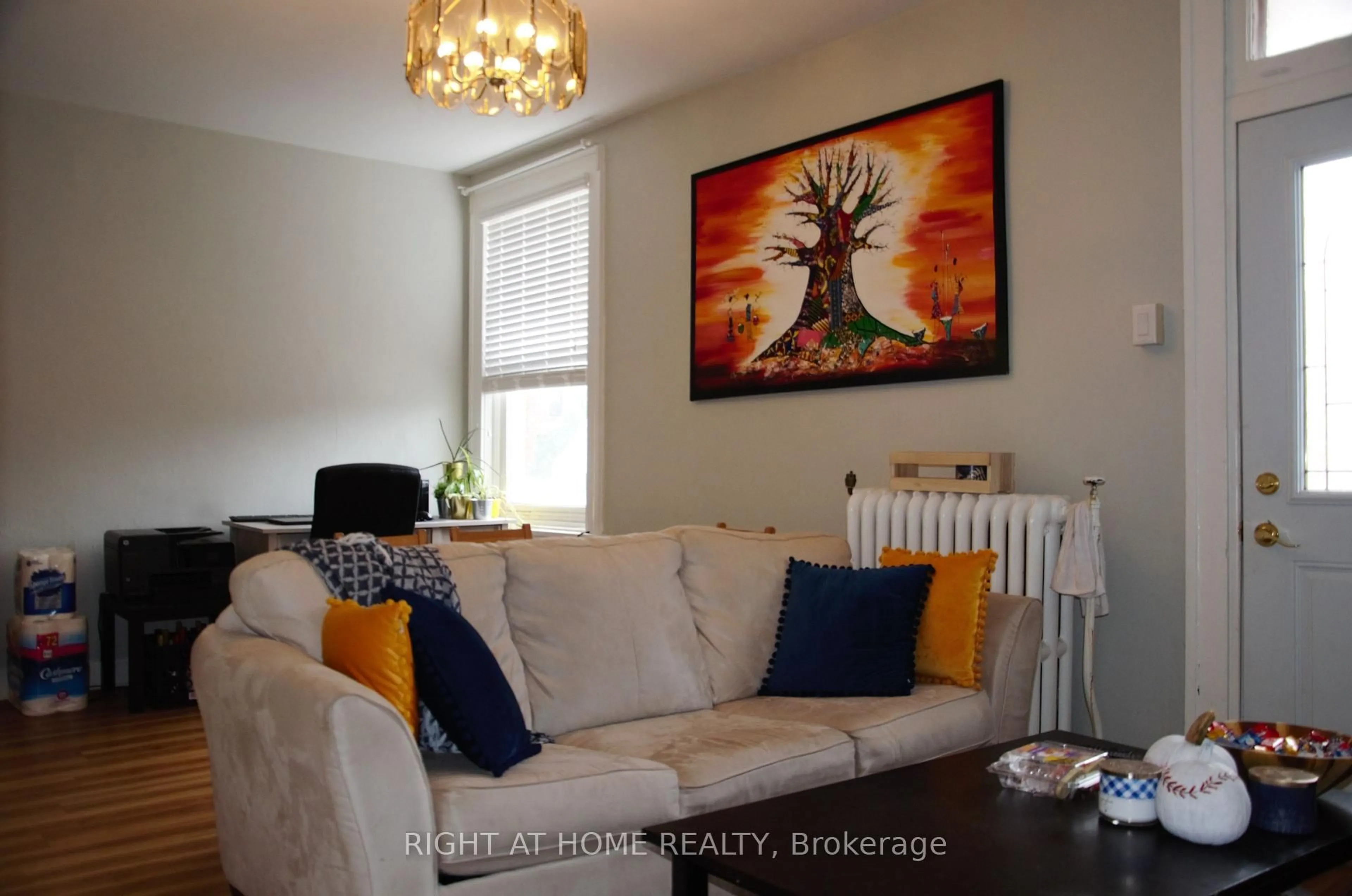 Living room with furniture, wood/laminate floor for 177 Goulburn Ave, Ottawa Ontario K1N 8E3