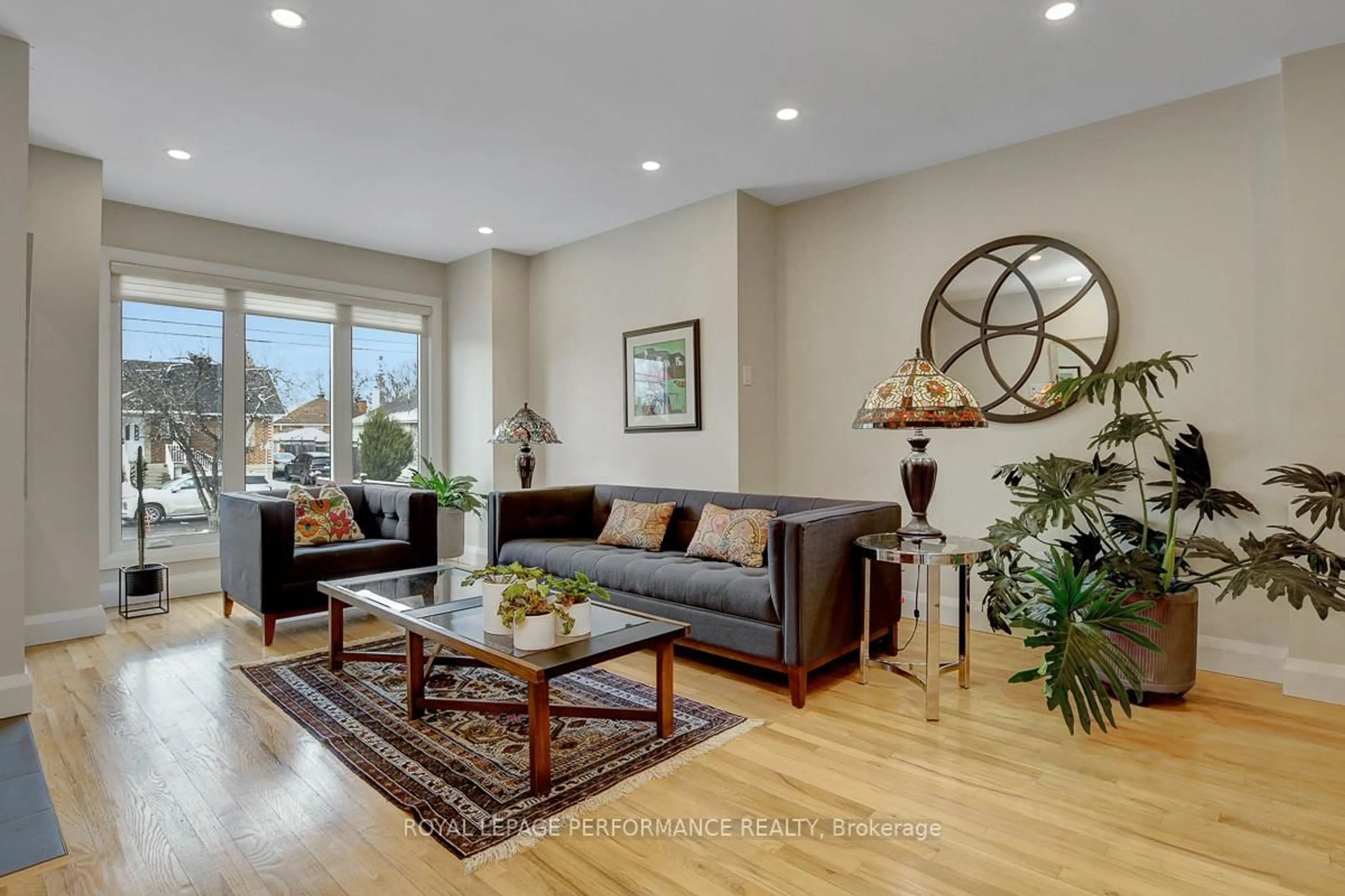 Living room with furniture, wood/laminate floor for 86 West Presland Rd, Ottawa Ontario K1K 2C3