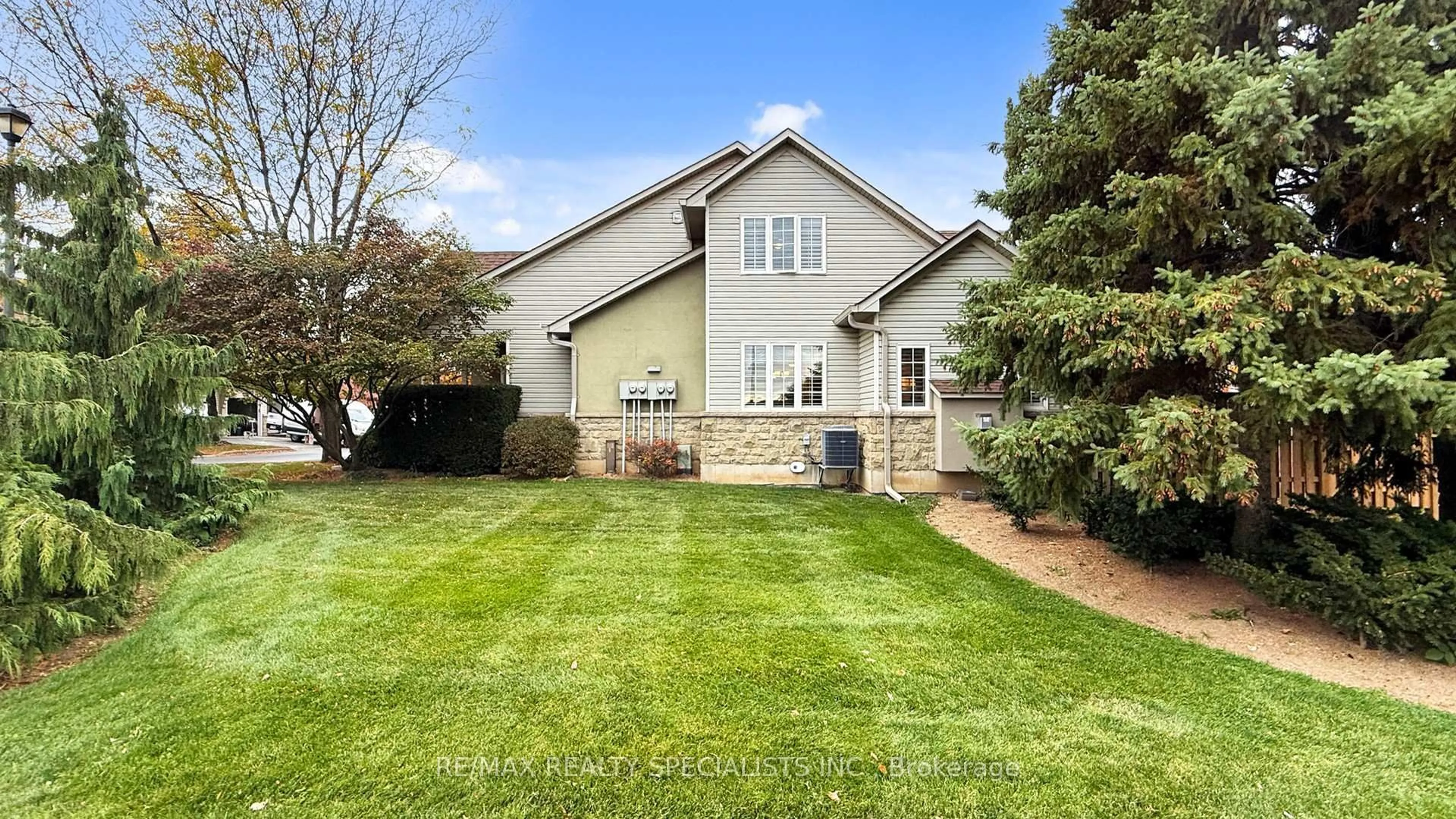 Home with vinyl exterior material, street for 212 Stonehenge Dr #1, Hamilton Ontario L9K 1N5